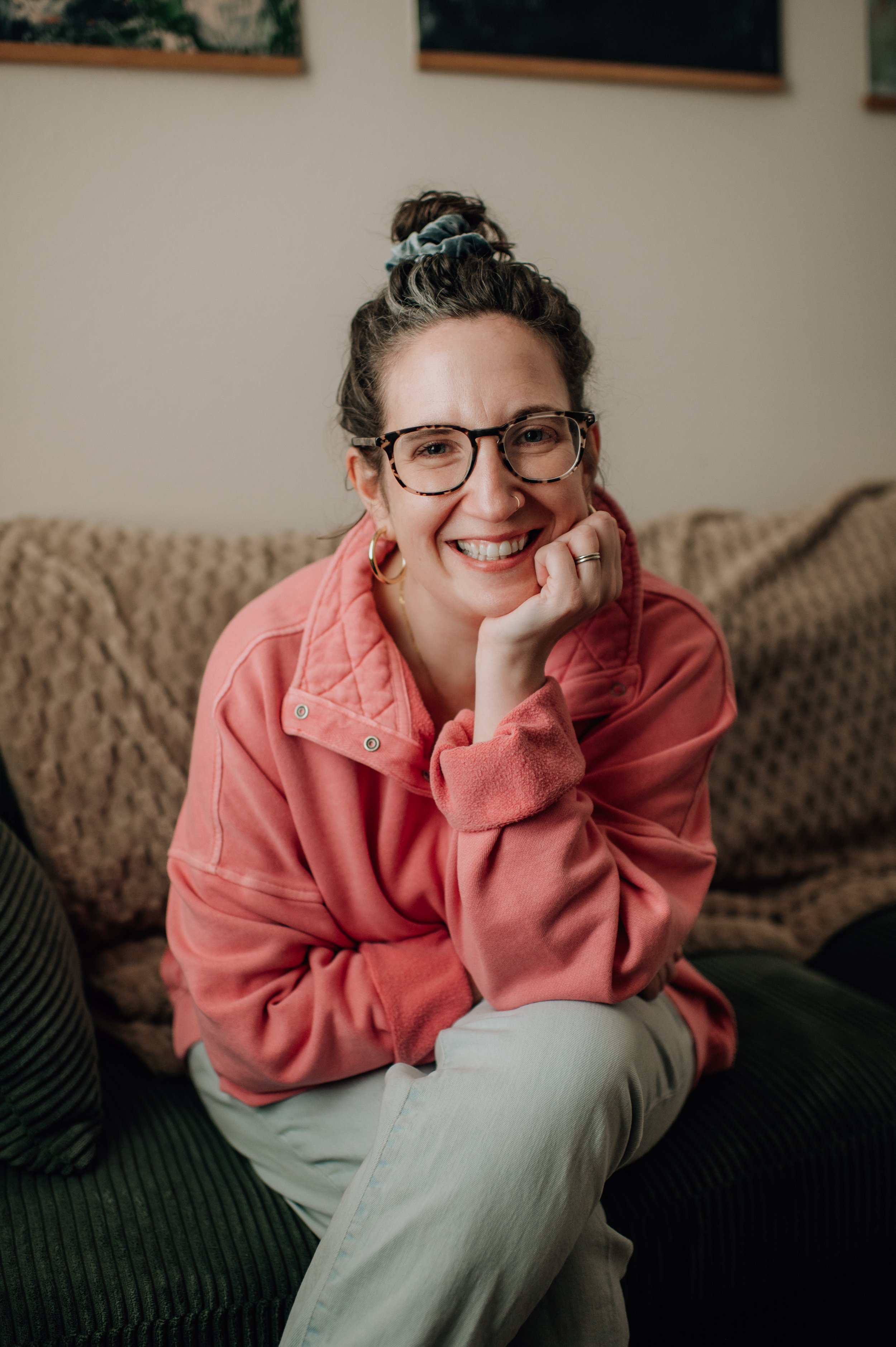 Headshot of Ashley in a Pink Shirt