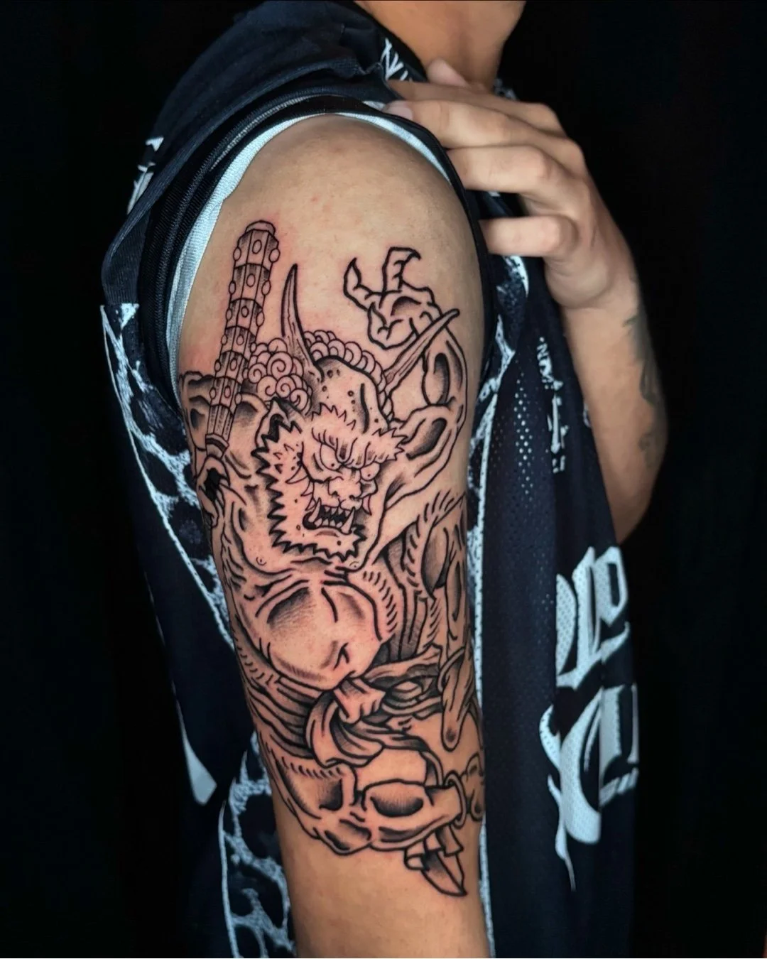 Traditional Japanese Oni tattoo done in West Palm Beach, Florida. This custom tattoo features a classic Oni inspired by Japanese folklore, designed with bold outlines, dynamic movement, and strong contrast true to traditional Japanese tattoo aestheti