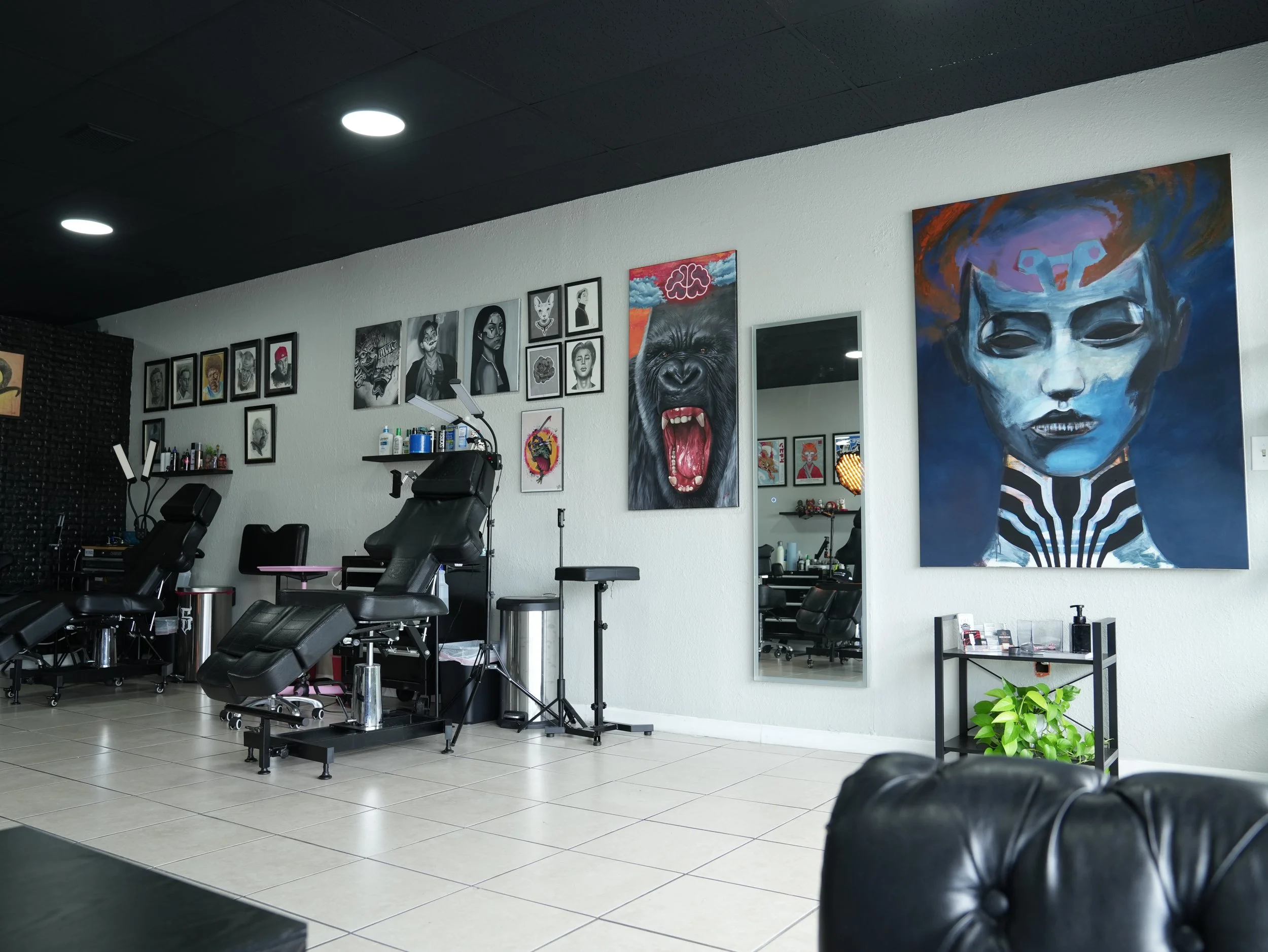 Interior of Good News Tattoo, a private tattoo studio in West Palm Beach, Florida, specializing in custom American Traditional, Japanese, Neo Traditional,Realism, Blackwork, Anime, and Fine Line tattoos.