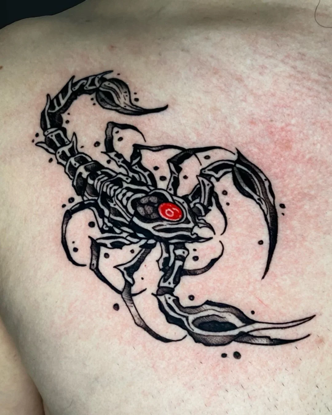 Blackwork scorpion tattoo created in West Palm Beach, Florida. This piece features a bold scorpion rendered in solid black ink with sharp linework and high contrast, emphasizing strength, protection, and resilience. The design uses a clean blackwork 