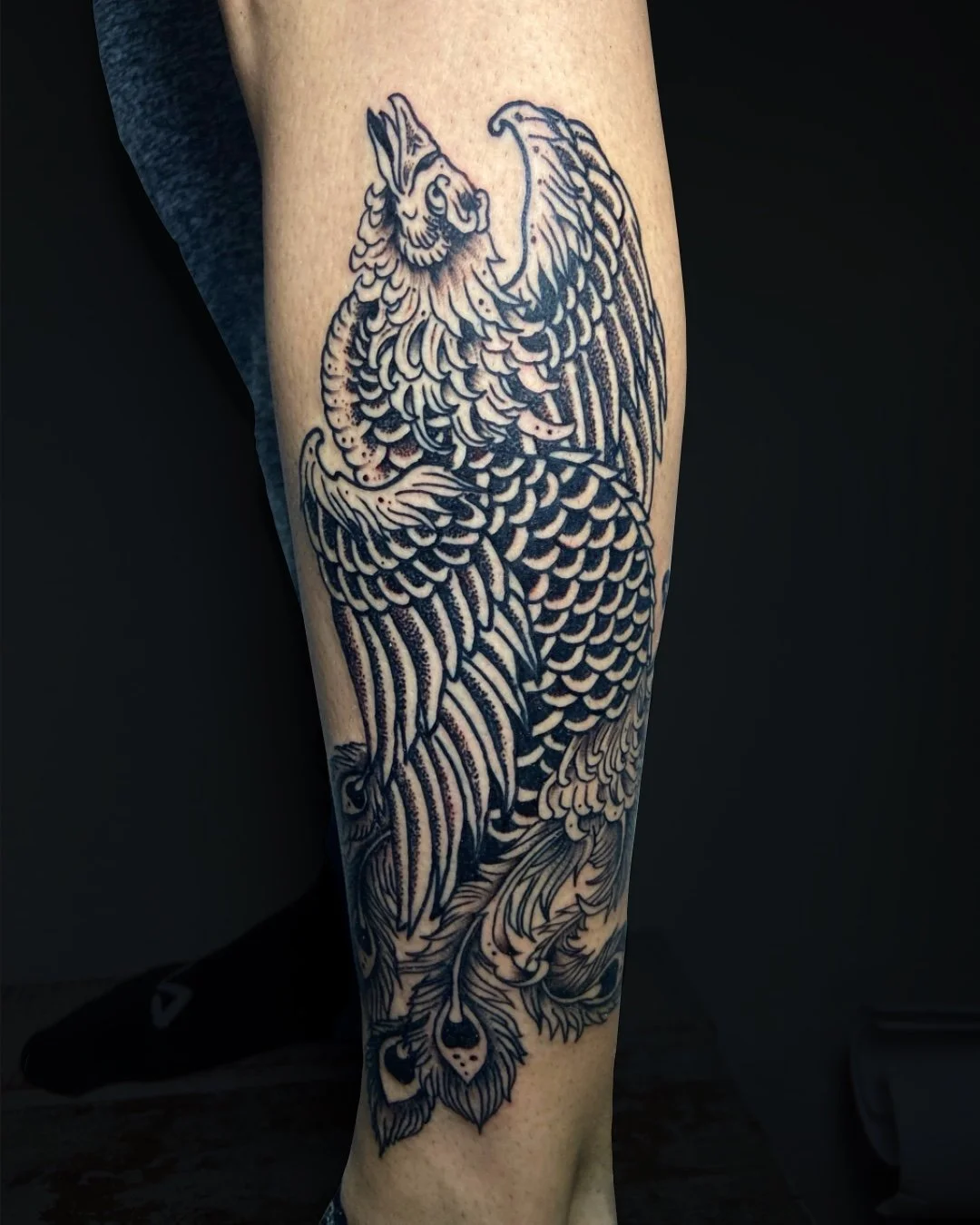 Japanese Traditional Phoenix tattoo in West Palm Beach, Florida, inspired by classic Irezumi imagery and executed with bold black linework and detailed shading. The phoenix (Hou-ou) is a powerful symbol in Japanese tattooing, representing rebirth, re