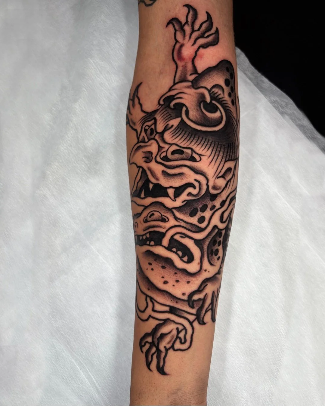 Traditional Japanese Kappa and frog tattoo done in West Palm Beach, Florida. This custom tattoo features a Kappa yokai standing over a traditional Japanese frog (Kaeru), inspired by classic Japanese folklore and tattoo tradition. Designed with bold o