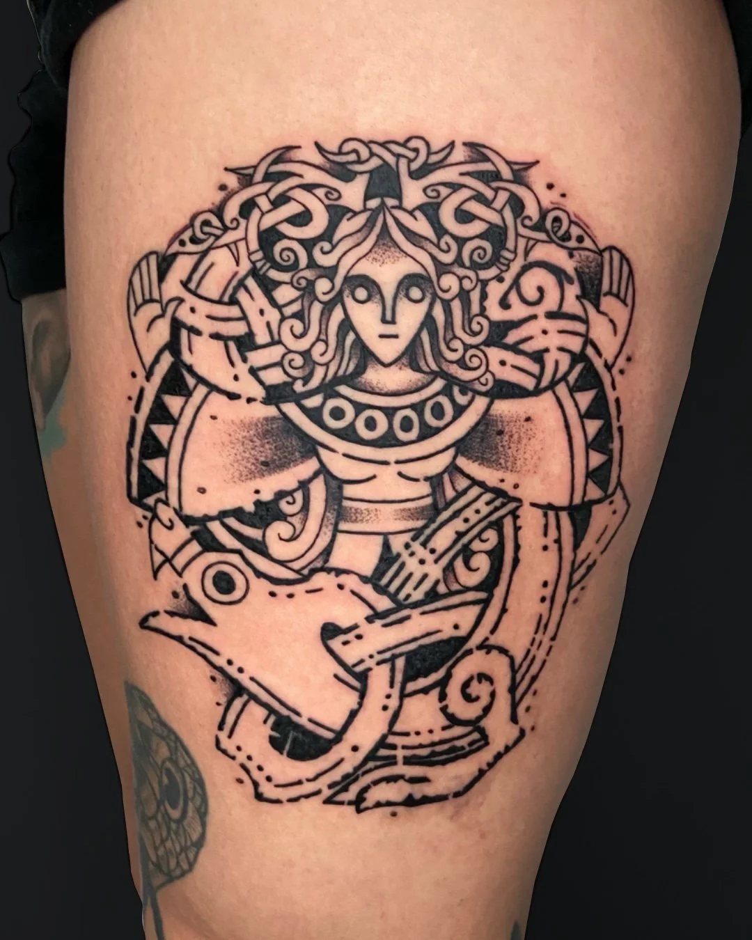 Viking goddess tattoo created in West Palm Beach, Florida. This blackwork piece depicts a Viking goddess inspired by Norse mythology, symbolizing strength, wisdom, and spiritual power. The design features bold linework, ornamental details, and a symm