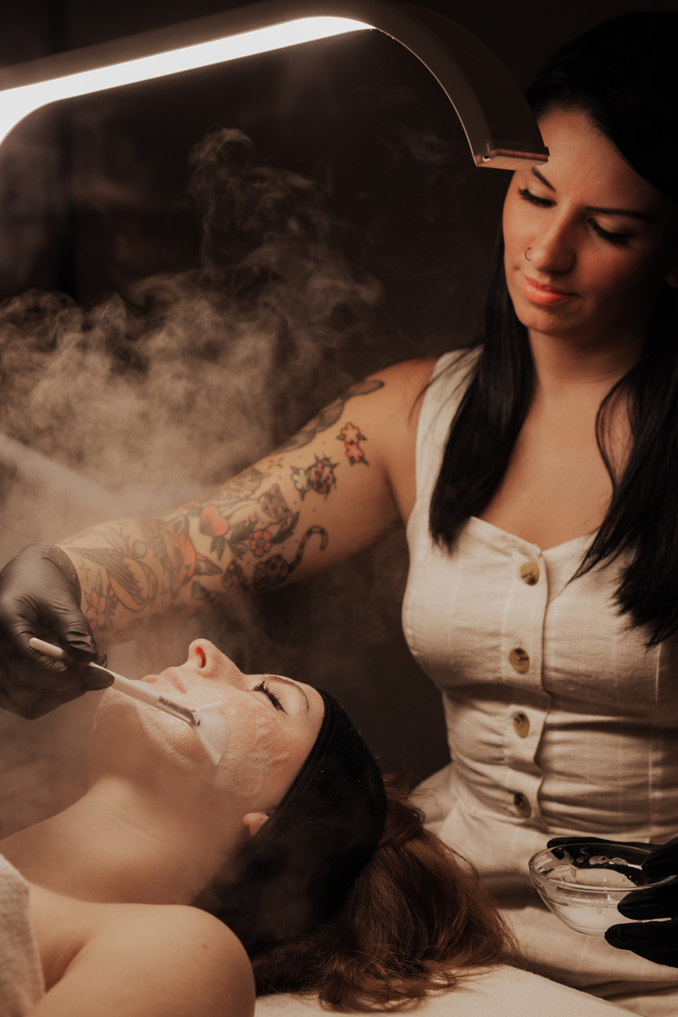 Facial treatment under a vapor lamp