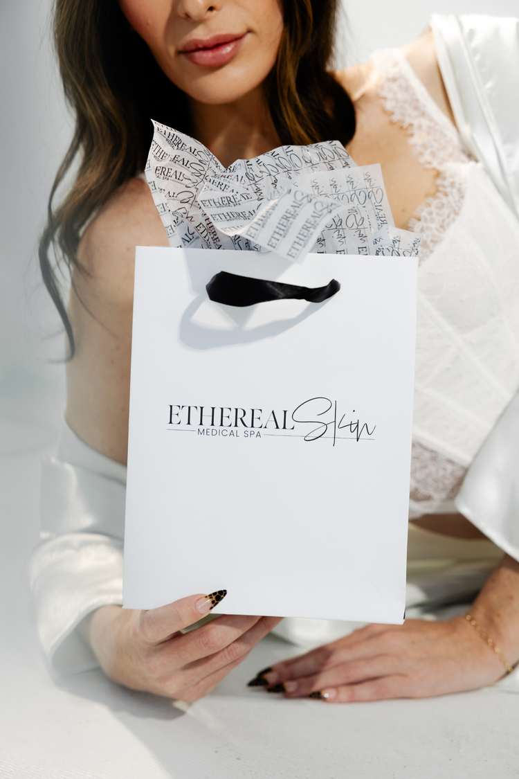 Model holding a branded shopping bag