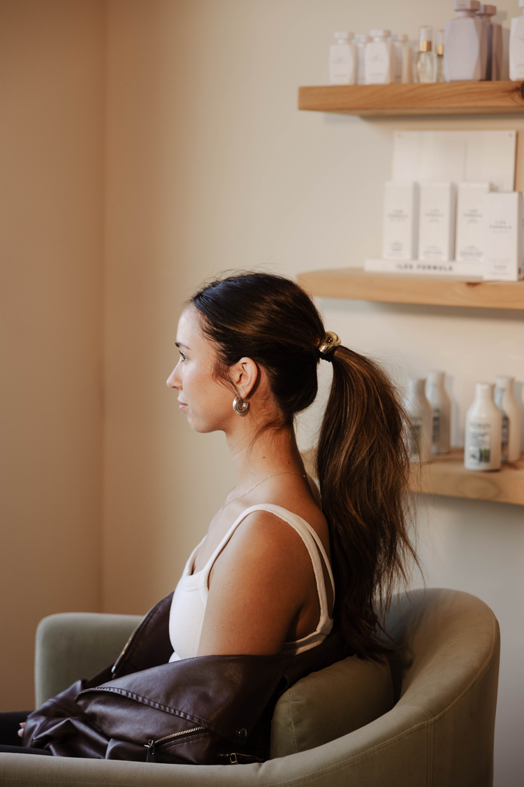 Client seated in a skincare studio