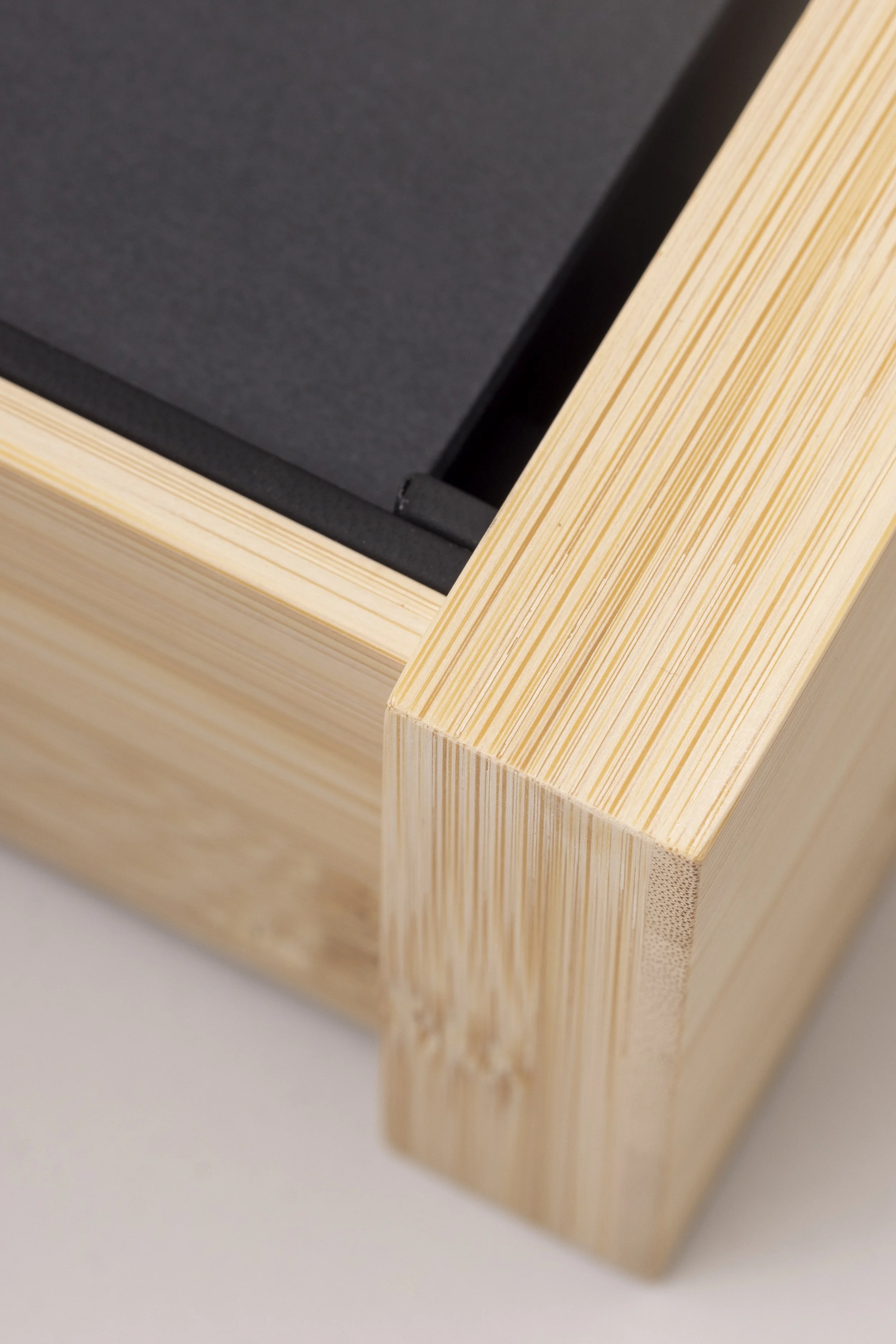 Close up of a bamboo watch box made for Christopher Ward