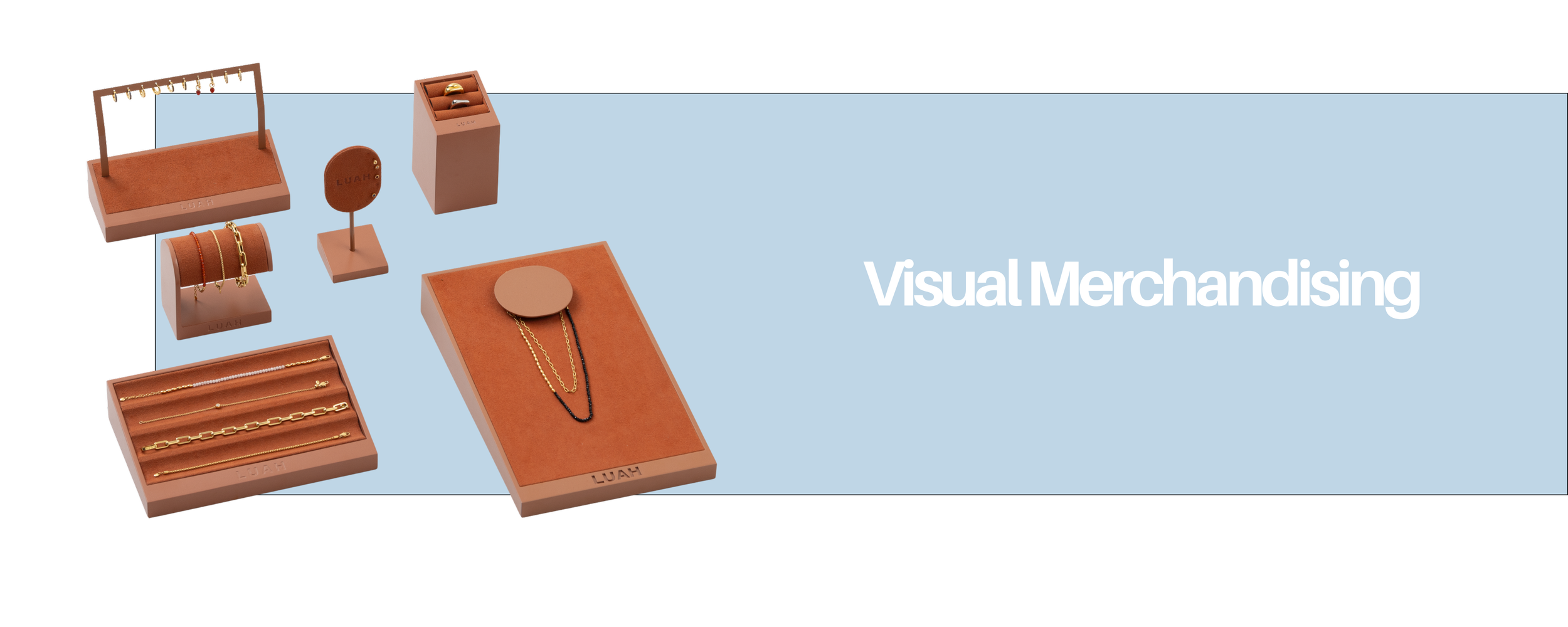 Display of jewelry and accessories with the text 'Visual Merchandising' on a blue background.