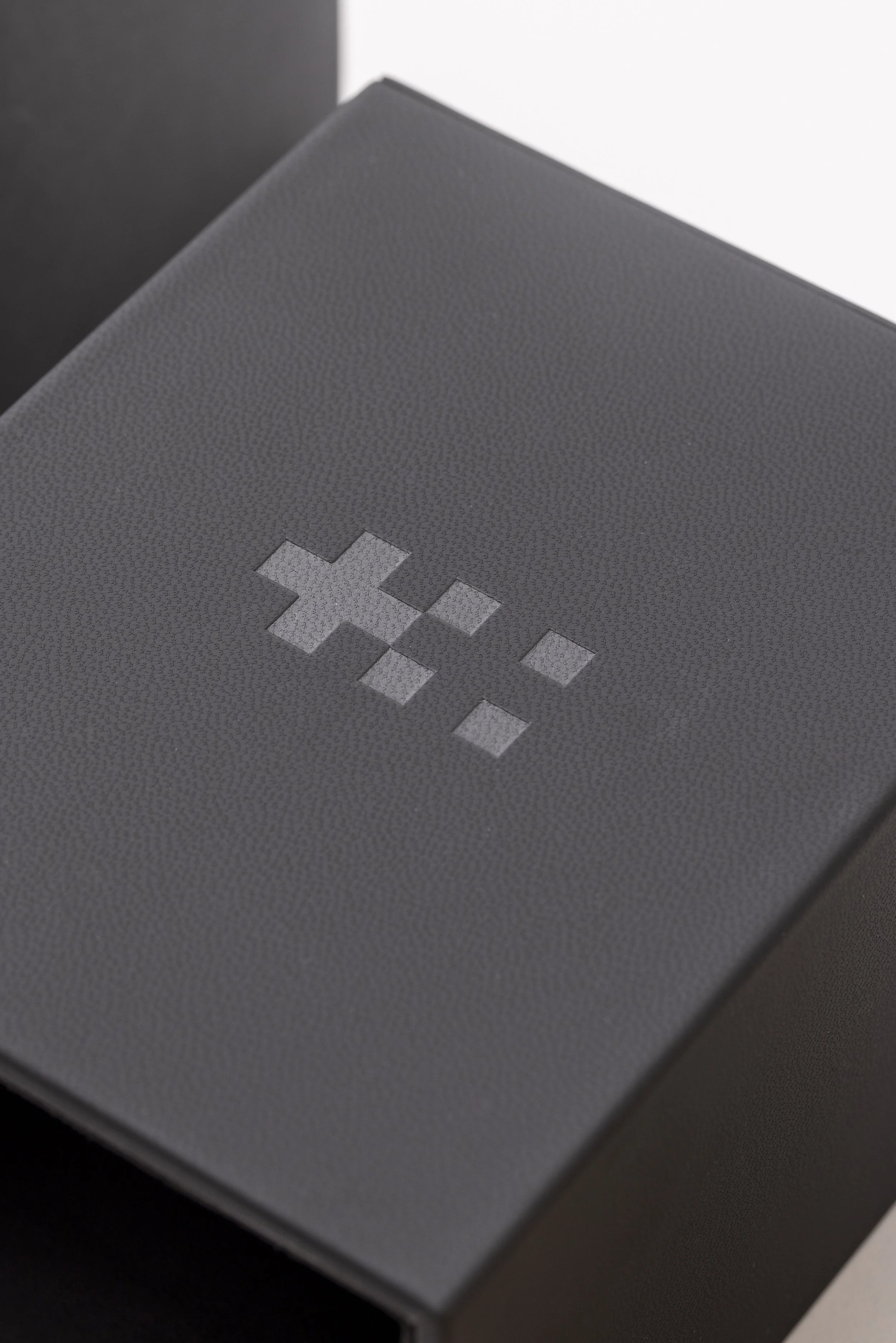 Close up of a leather watch box made for Christopher Ward