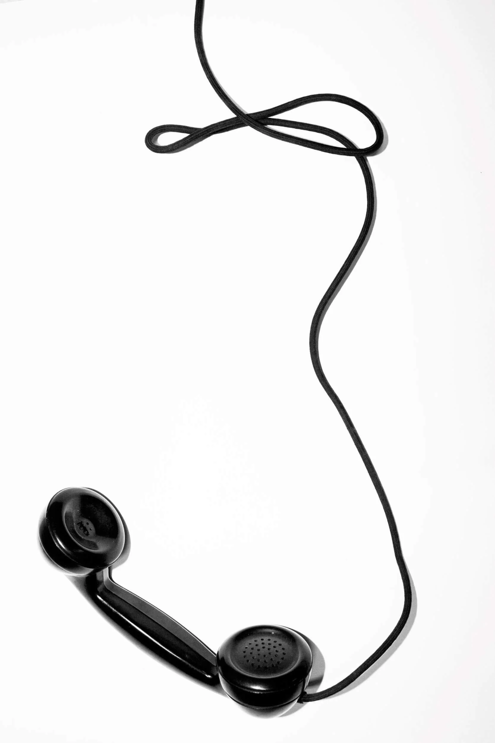 Contact Onvo for prostate cancer treatment consultations — black classic phone handset on white background, symbolizing direct patient support.