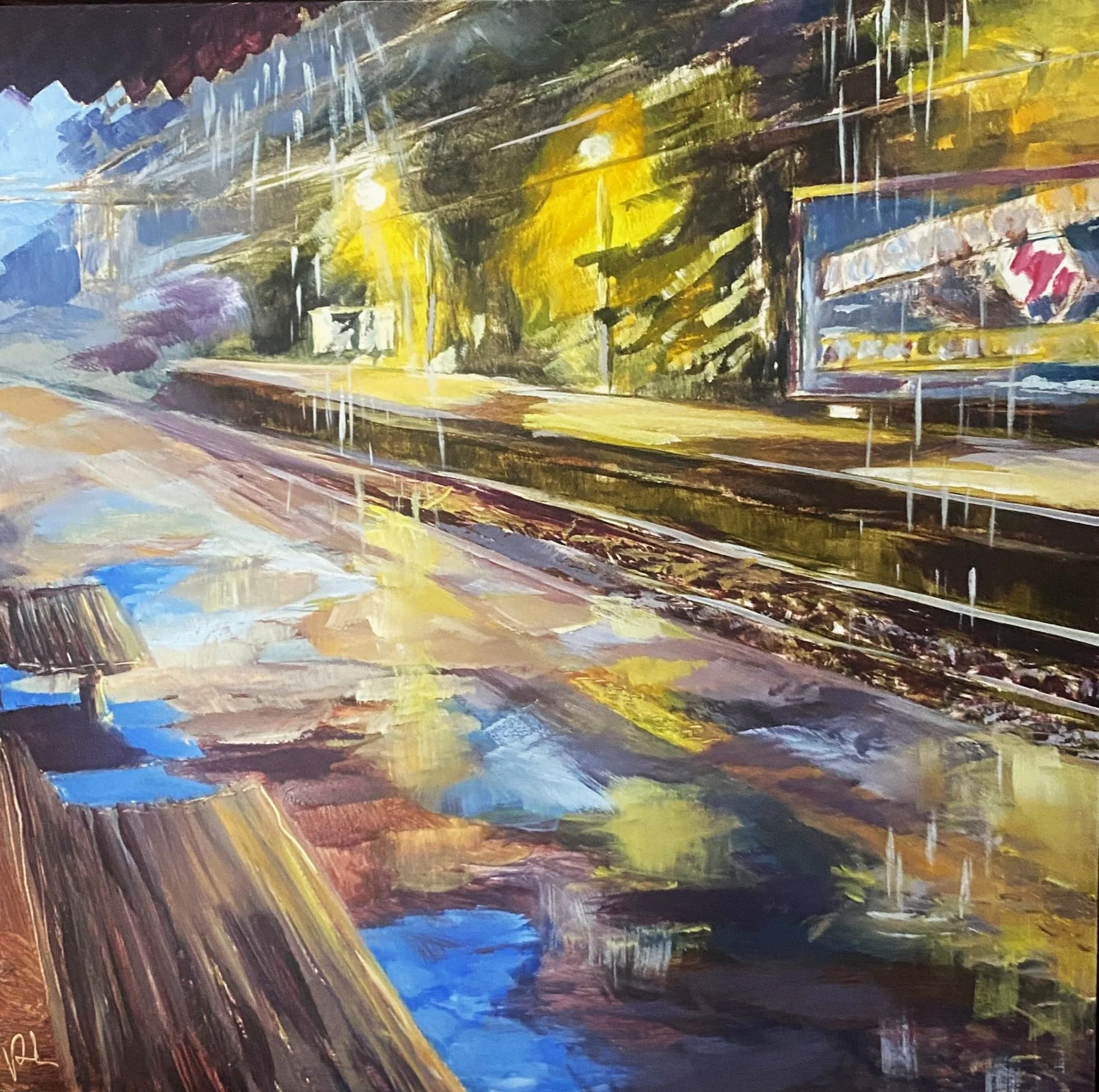 I like how it is dark and raining but the viewer in under cover and dry.  The billboard is lit up over on the other platform and the lights highlight the rain coming down.