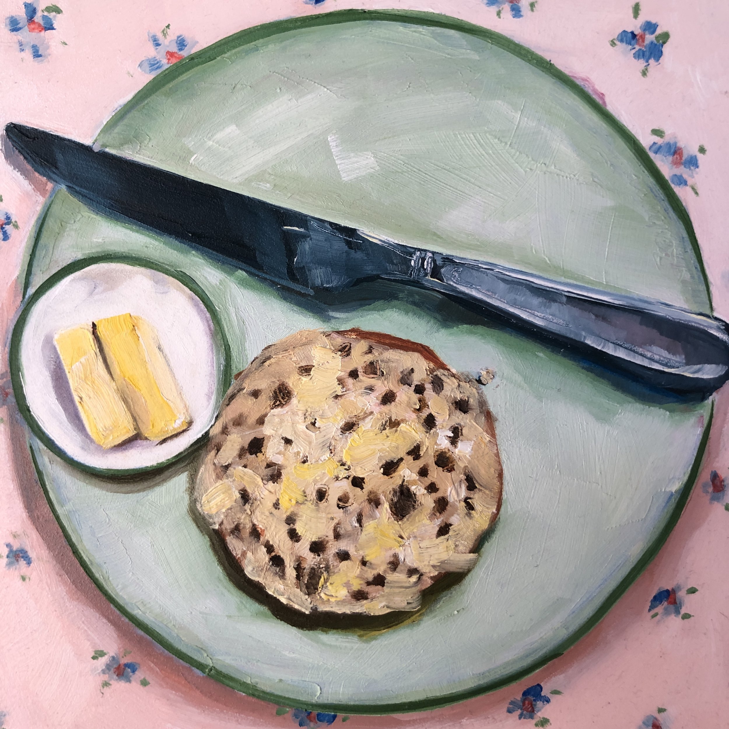 I love the colours in this little study of a crumpet on a plate, resting on the simple pattern with the knife adjacent