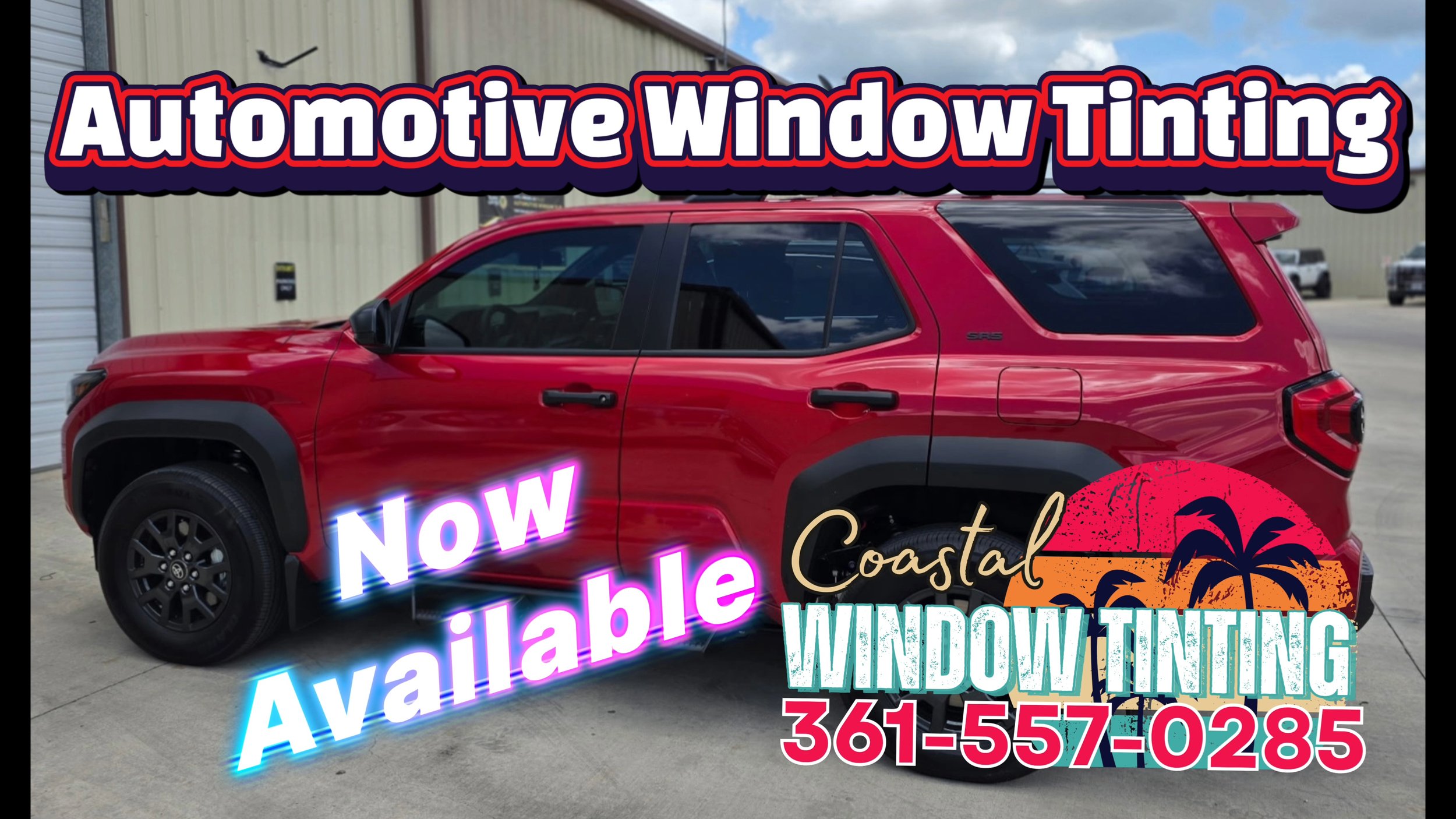 Red SUV parked outside a beige industrial building with a sign advertising automotive window tinting, coastal-themed logo, and a phone number.