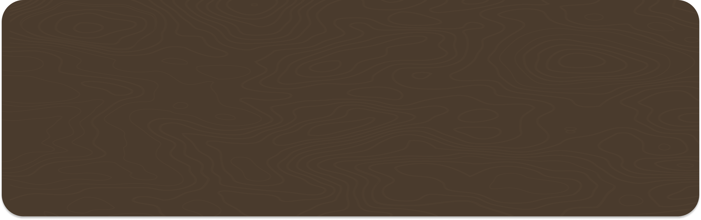 A close-up of a piece of chocolate with a wood grain texture.