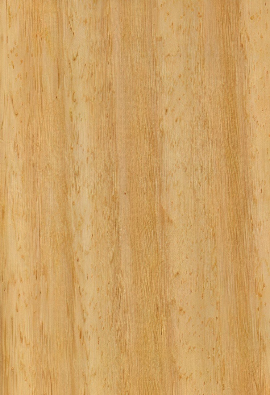 A close-up view of a wood grain surface, featuring light-colored wood with visible texture and natural patterns.