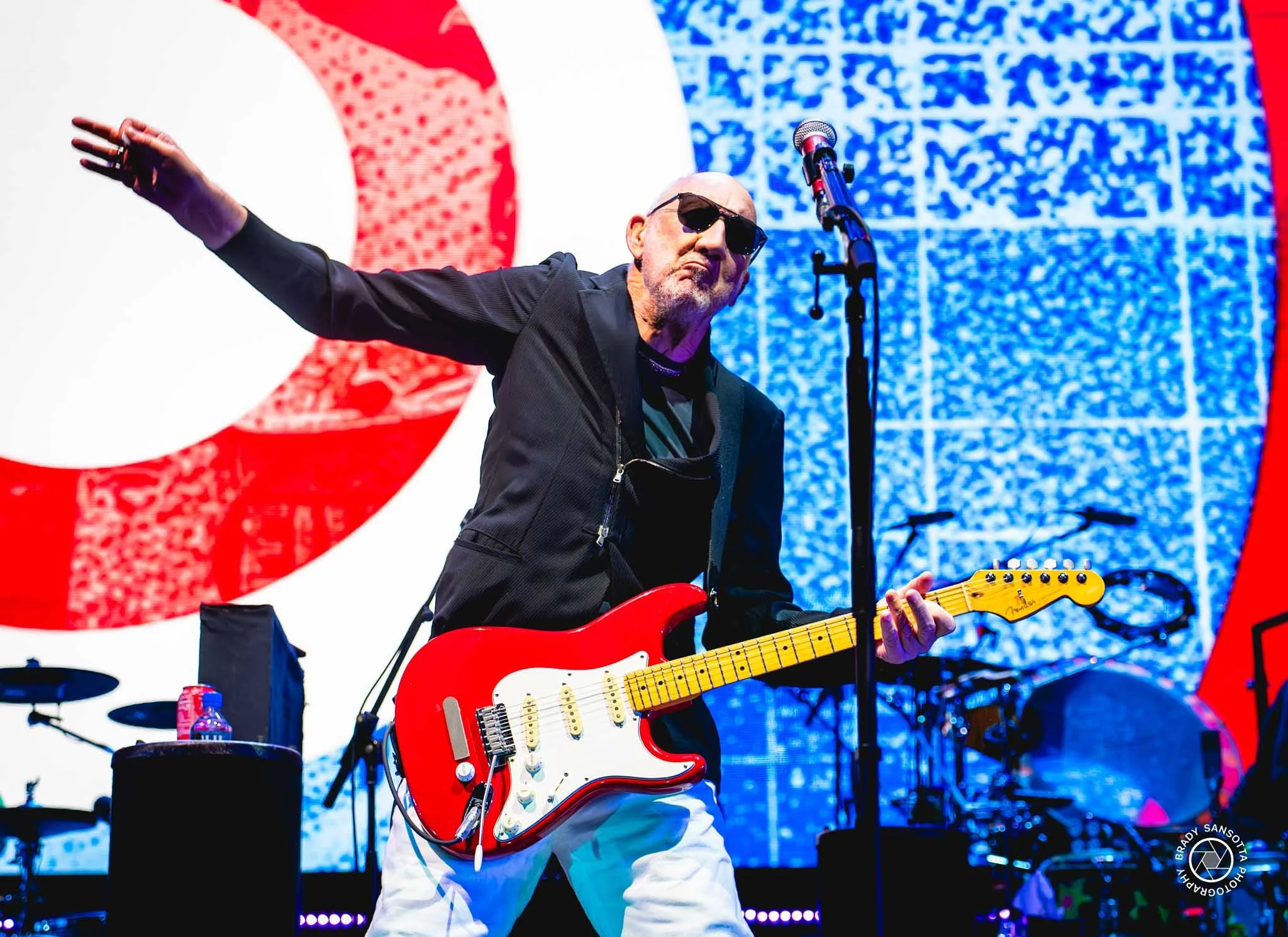 Pete Townshend performing his signature windmill guitar move on stage during The Who farewell concert at Madison Square Garden.