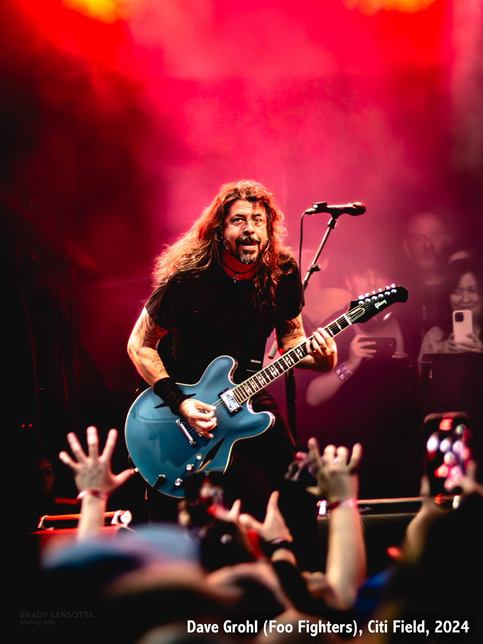 Colorful portrait of Dave Grohl of Foo Fighters and Nirvana playing guitar during a rock concert at Citi Field in Queens, NYC.