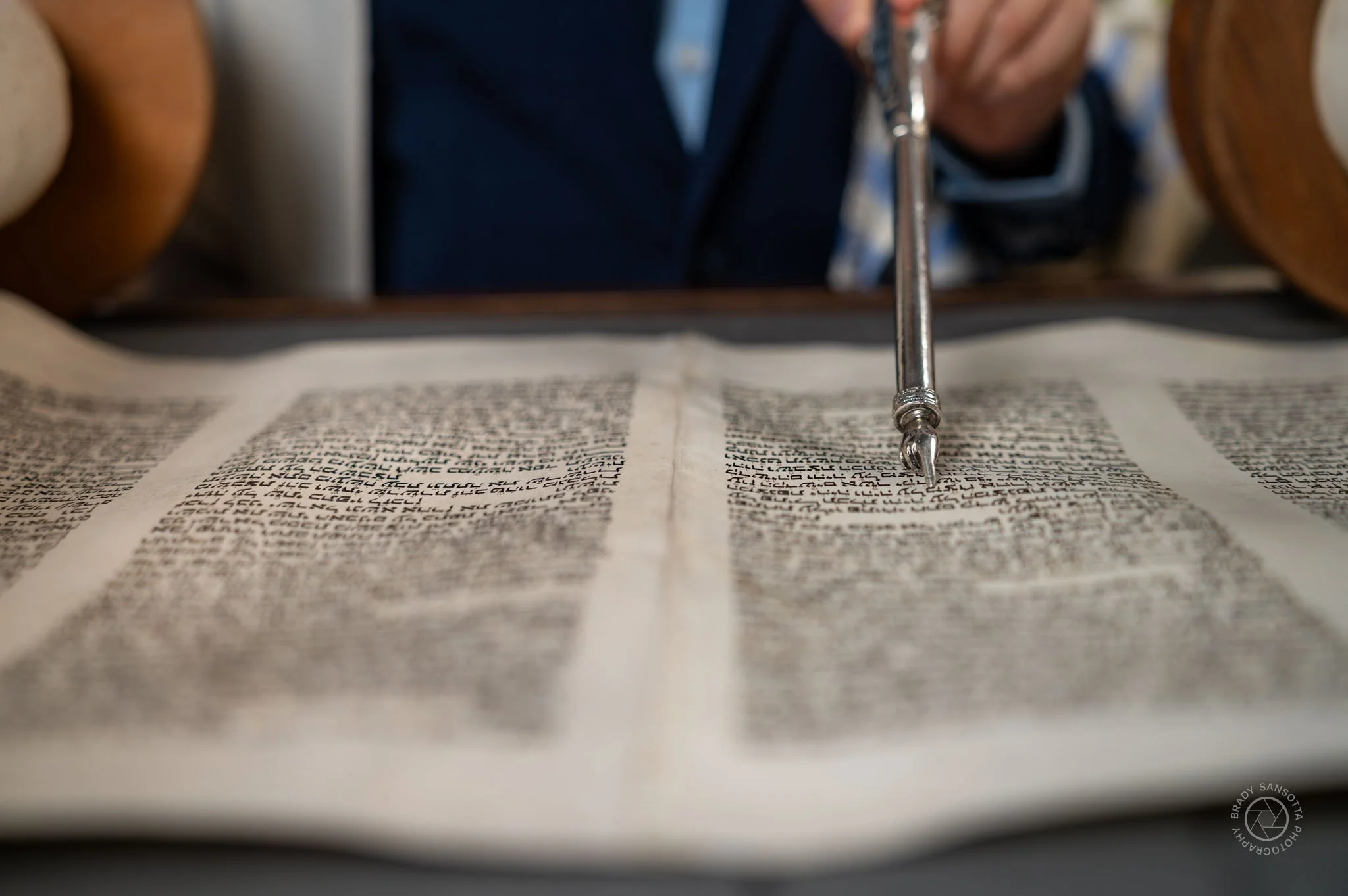 Close-up of Torah scroll and pointer. Detail photography of Bar Mitzvah ceremony at Temple Sinai in Tenafly.