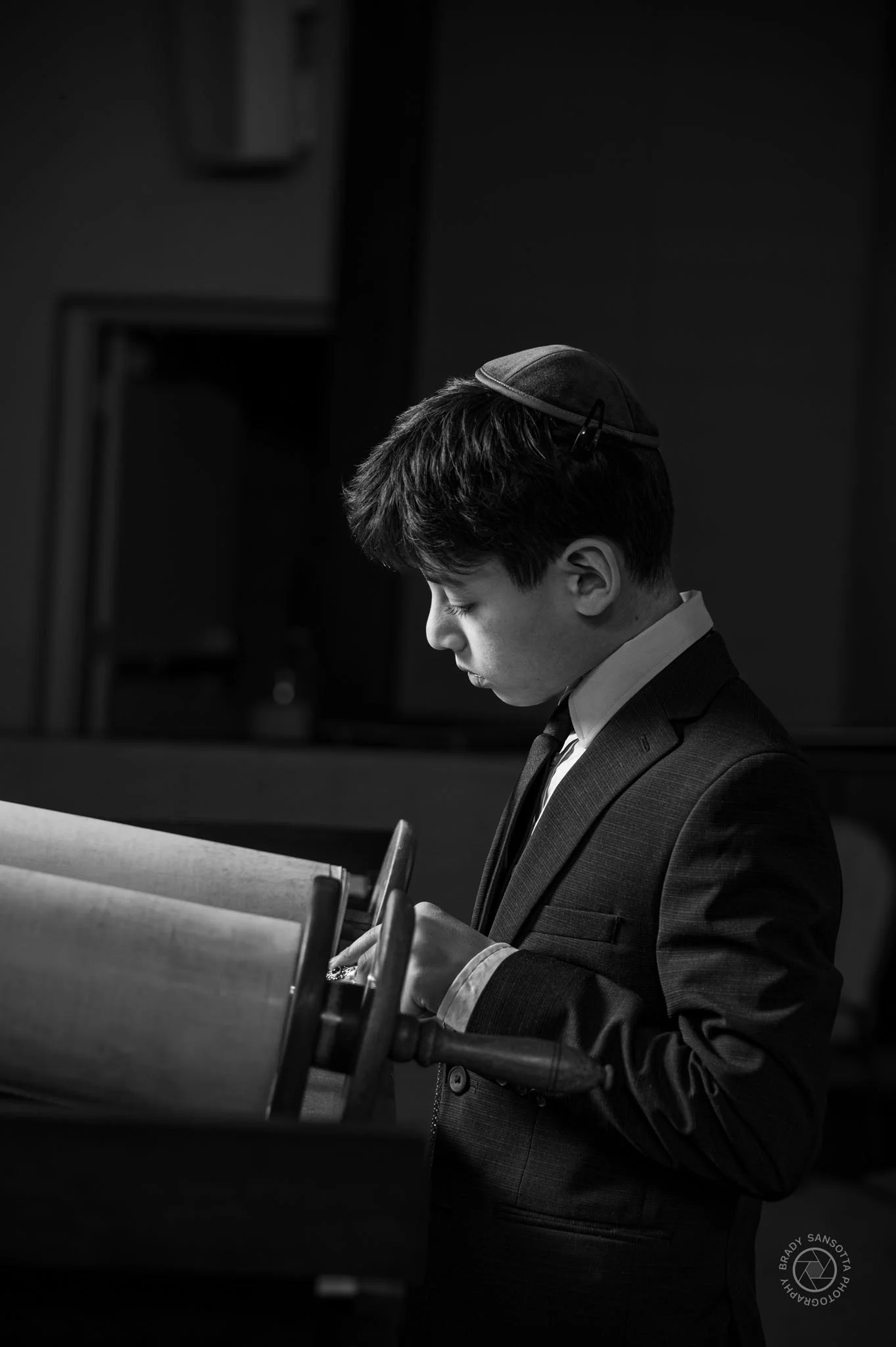 Black and white Bar Mitzvah portrait in tallit at Temple Sinai. Professional synagogue portrait session.