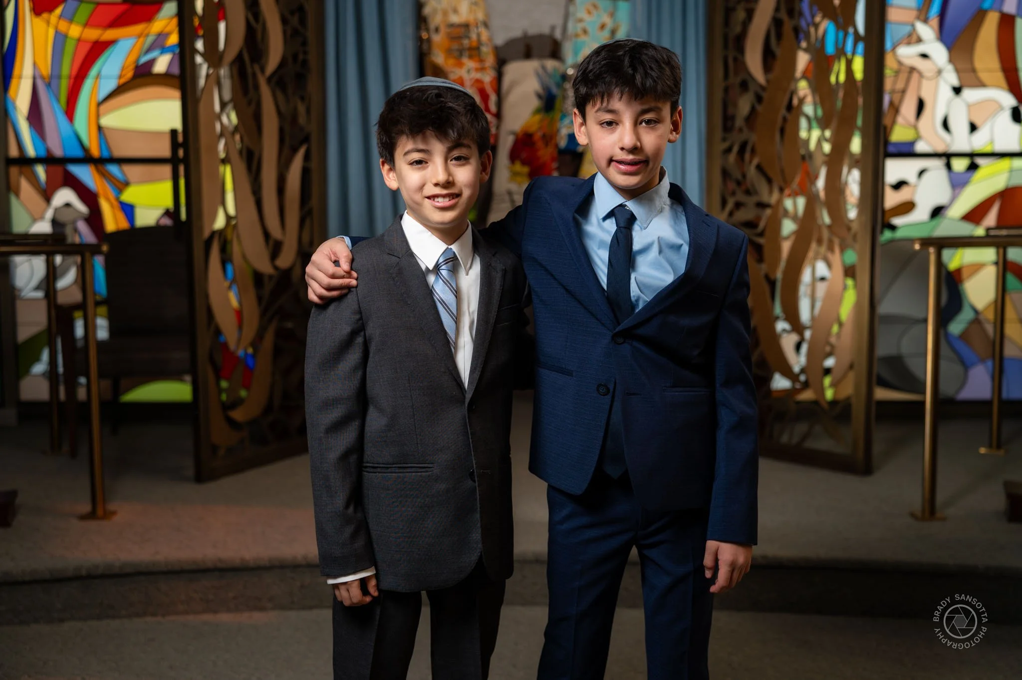 Candid portrait of brothers at Temple Sinai. Jewish milestone photography in Bergen County, New Jersey.