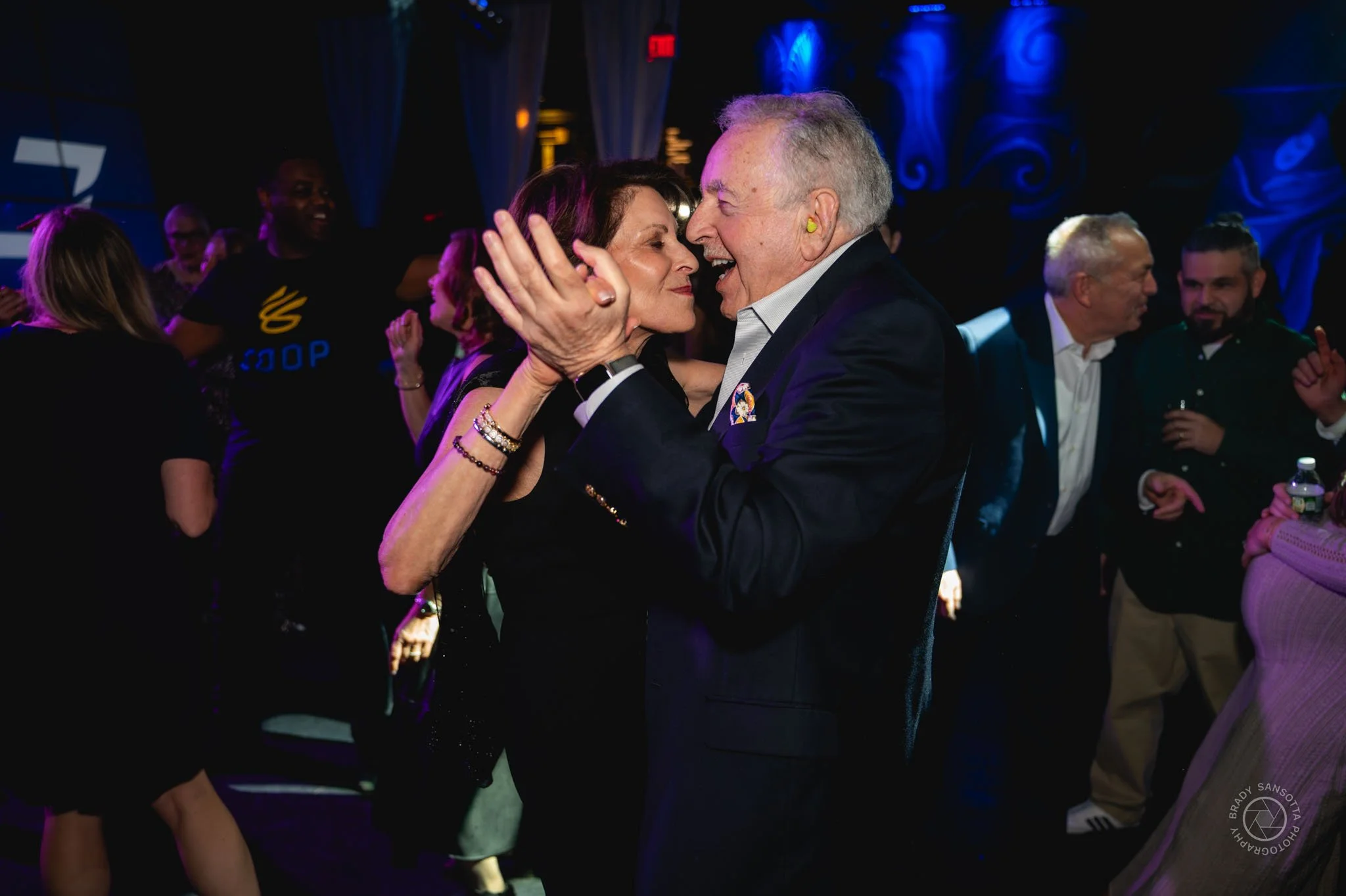 Candid of couple dancing during Bar Mitzvah party in New York metropolitan area.