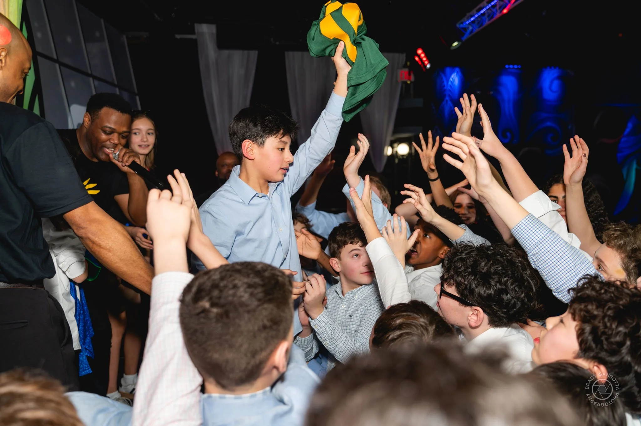 Packed dance floor during Bar Mitzvah party at Powerhouse Studios for theme merch.