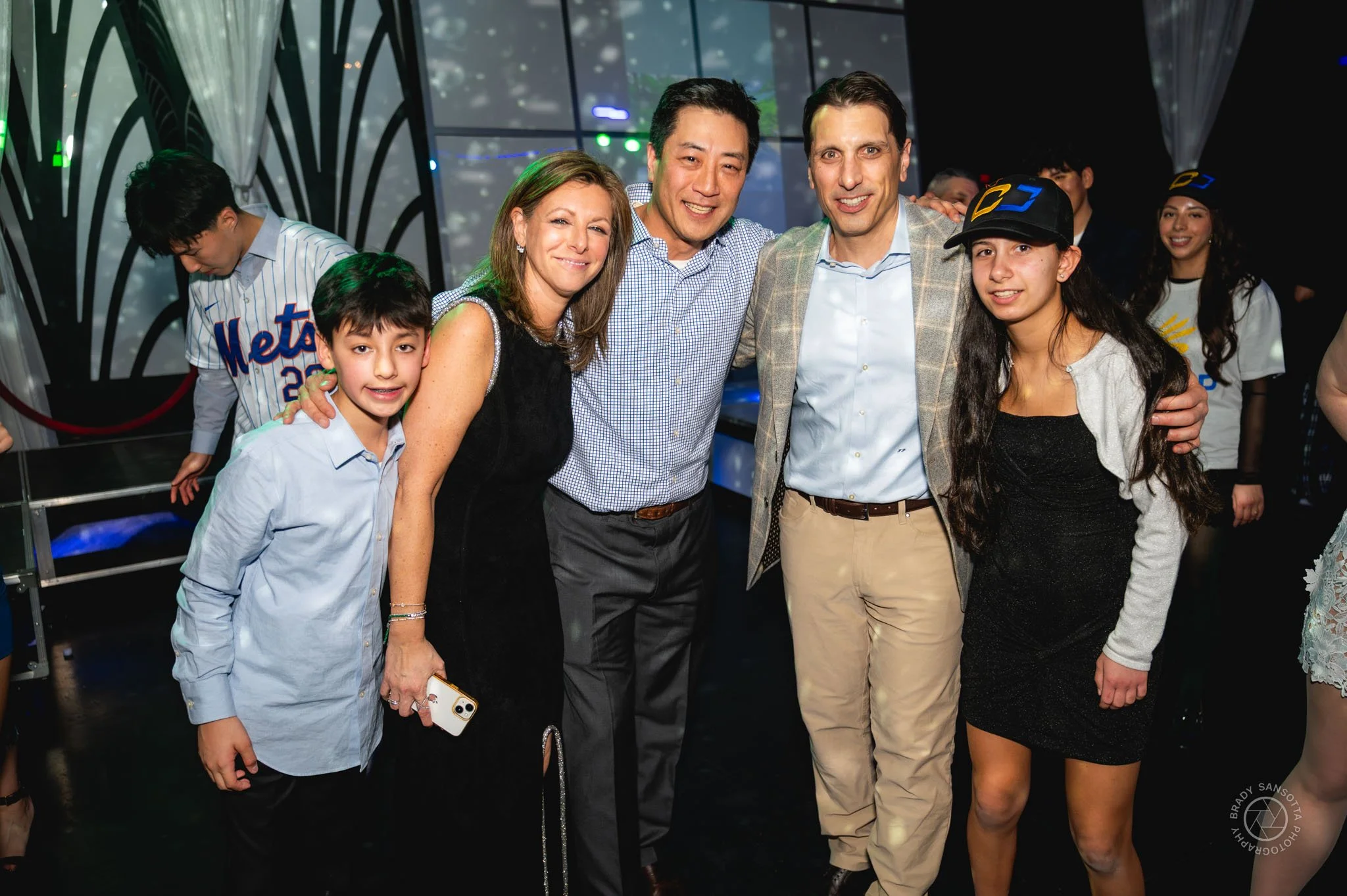 Candid moment with friends at Powerhouse Studios Bar Mitzvah party in Paramus, New Jersey.