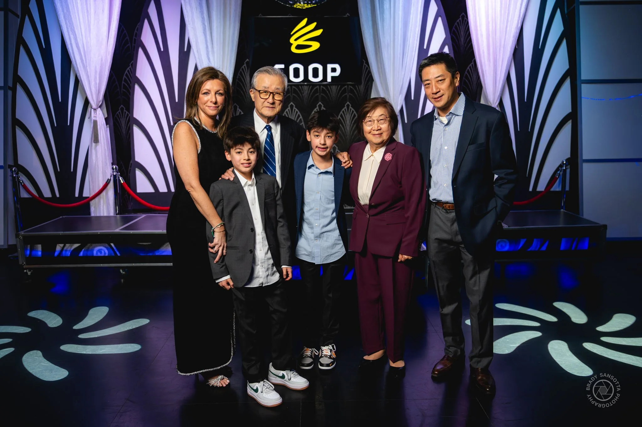Group portrait session with Bar Mitzvah boy and grandparents with professional event lighting.