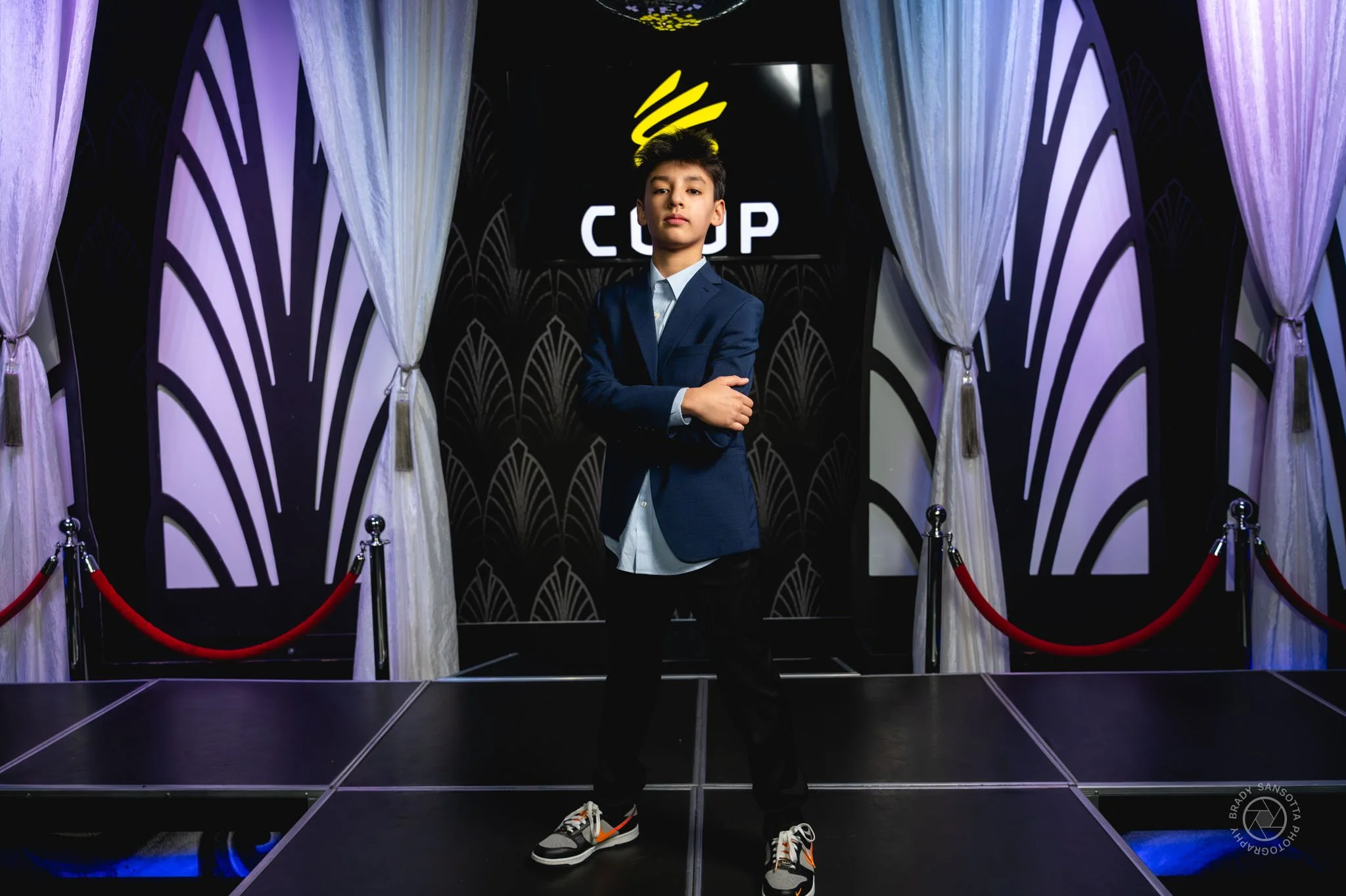 Candid photography of Bar Mitzvah boy pose at Powerhouse Studios Paramus. Party highlights.