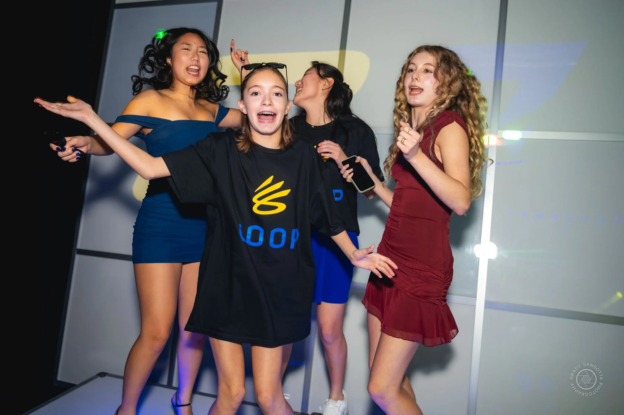 Candid shot of kids on stage at high-energy Bar Mitzvah party photography in Paramus, NJ.