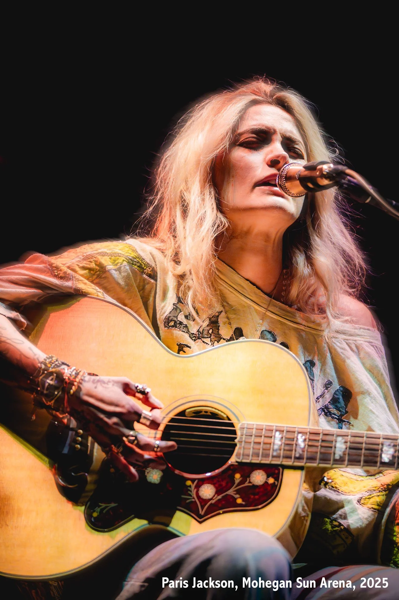Singer, model, and actress Paris Jackson plays guitar at Mohegan Sun Arena in Uncasville, Connecticut.
