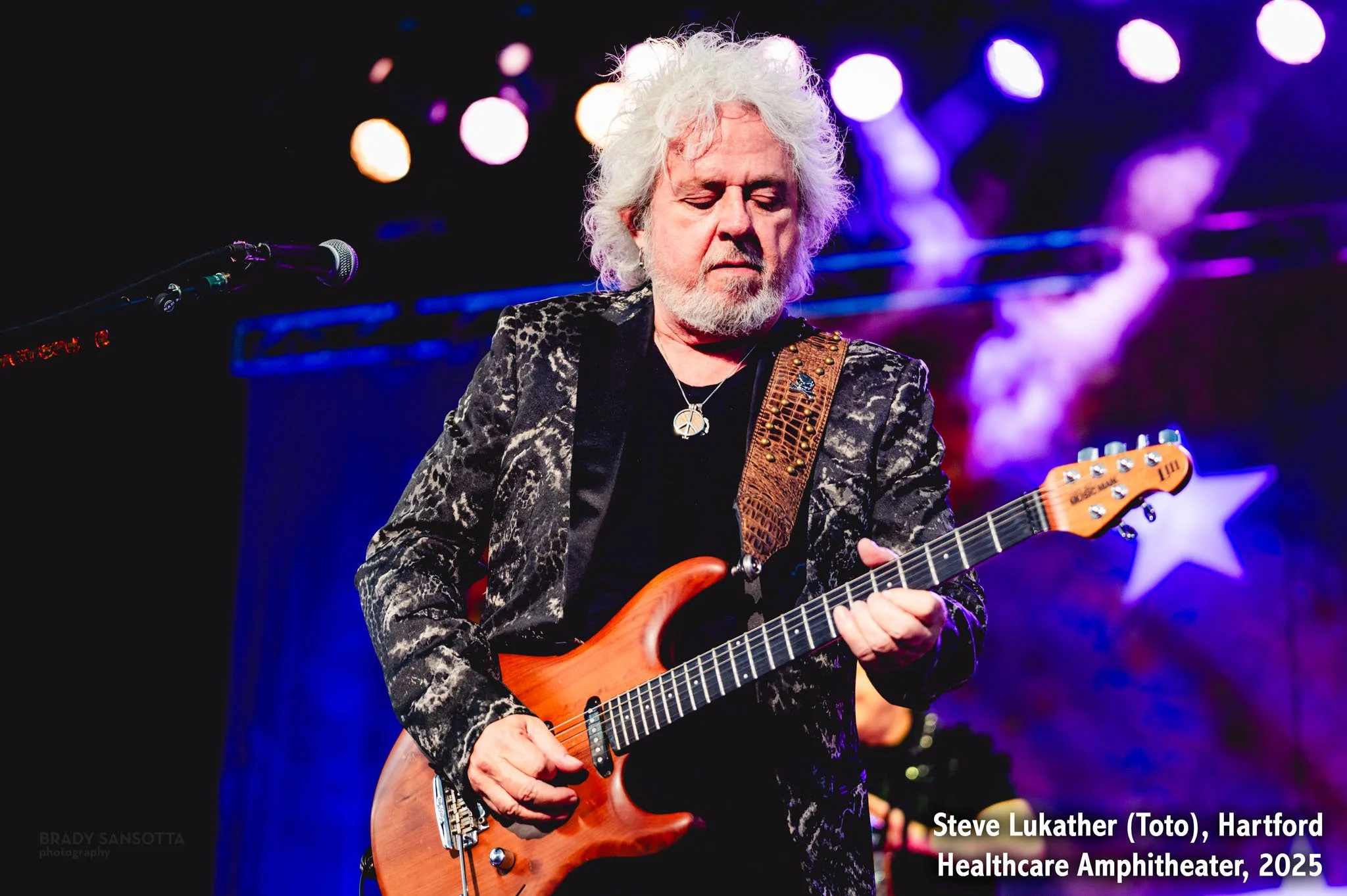 Steve Lukather of Toto playing electric guitar with Ringo Starr & His All Starr Band in Bridgeport, CT.