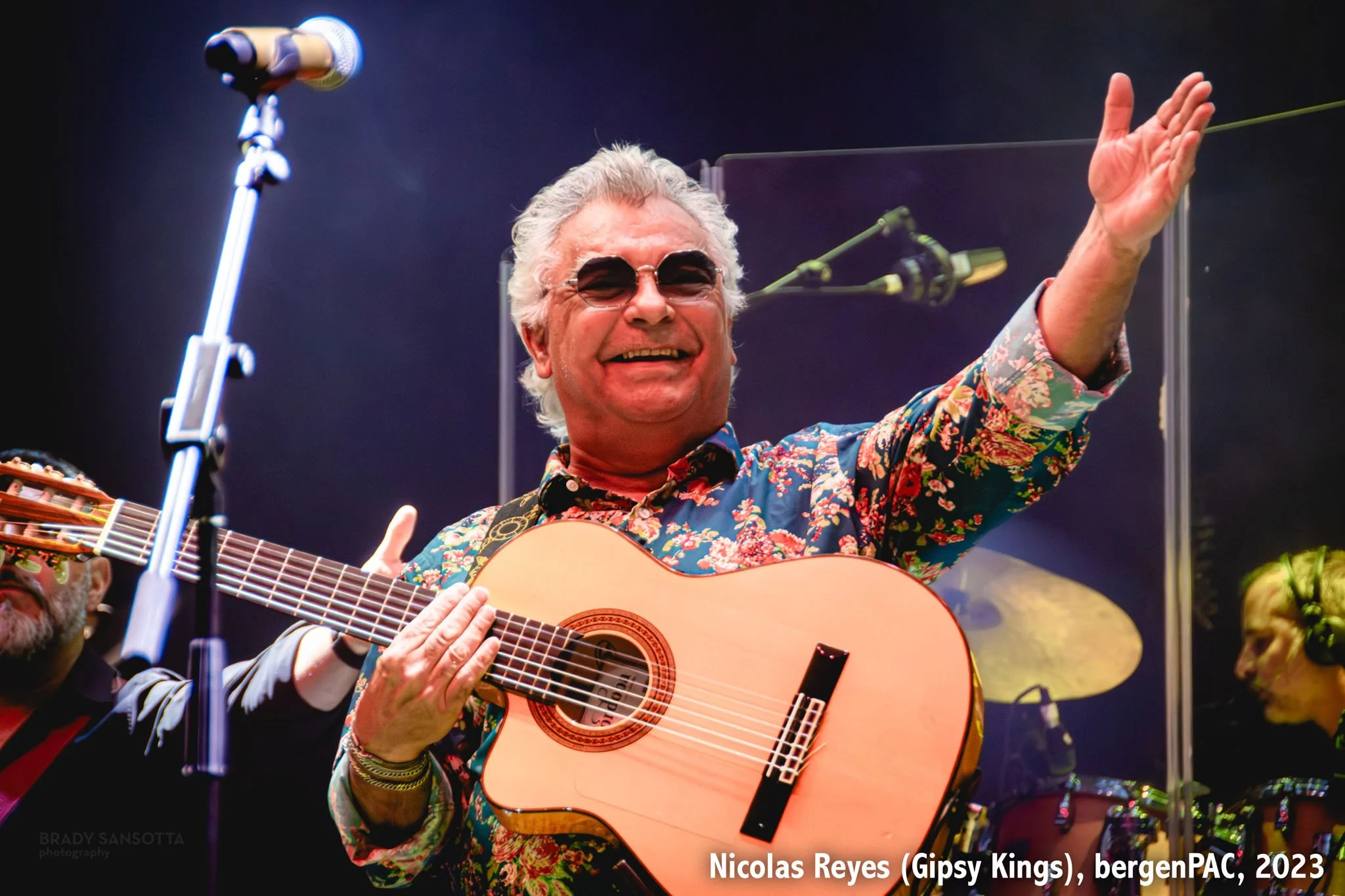 Nicolas Reyes of the Gipsy Kings performing with guitar and arms wide open at BergenPAC in Englewood, NJ.