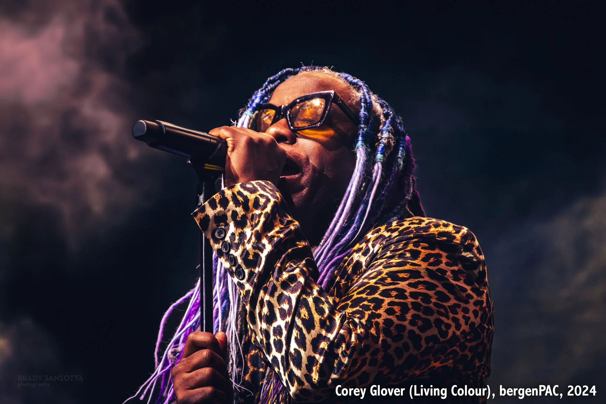 Dramatic close-up portrait of Corey Glover singing through stage fog at BergenPAC in Englewood, NJ.