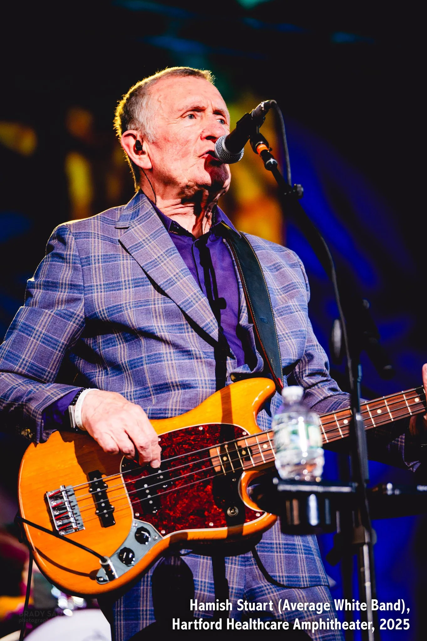 Hamish Stuart of Average White Band playing bass live with Ringo Starr at Hartford HealthCare Amphitheater in Bridgeport, CT.
