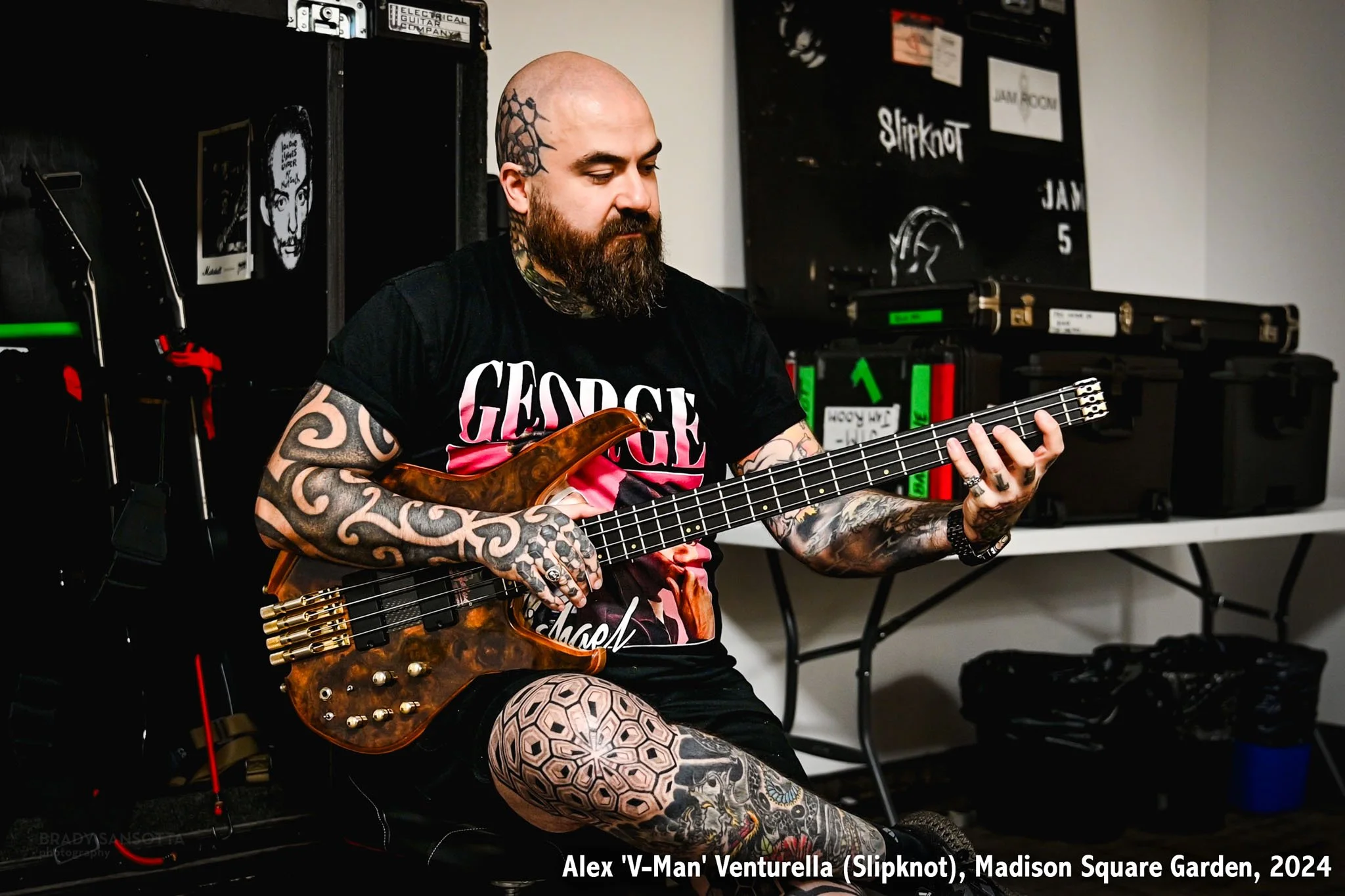 VMan of Slipknot playing bass guitar backstage at Madison Square Garden in NYC for a Bass Magazine interview feature.