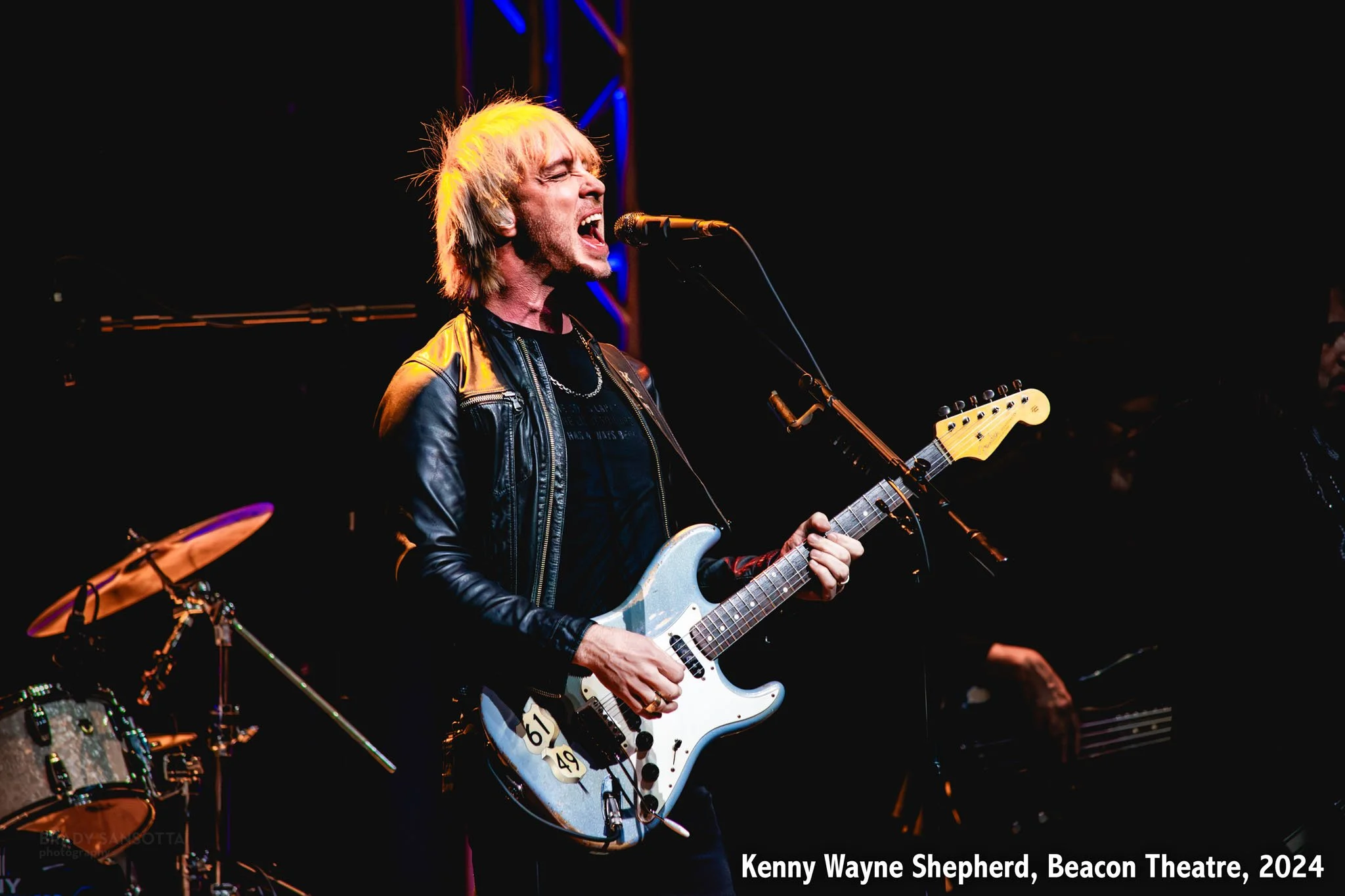 Kenny Wayne Shepherd playing blues guitar during a live concert at the Beacon Theatre in New York City.