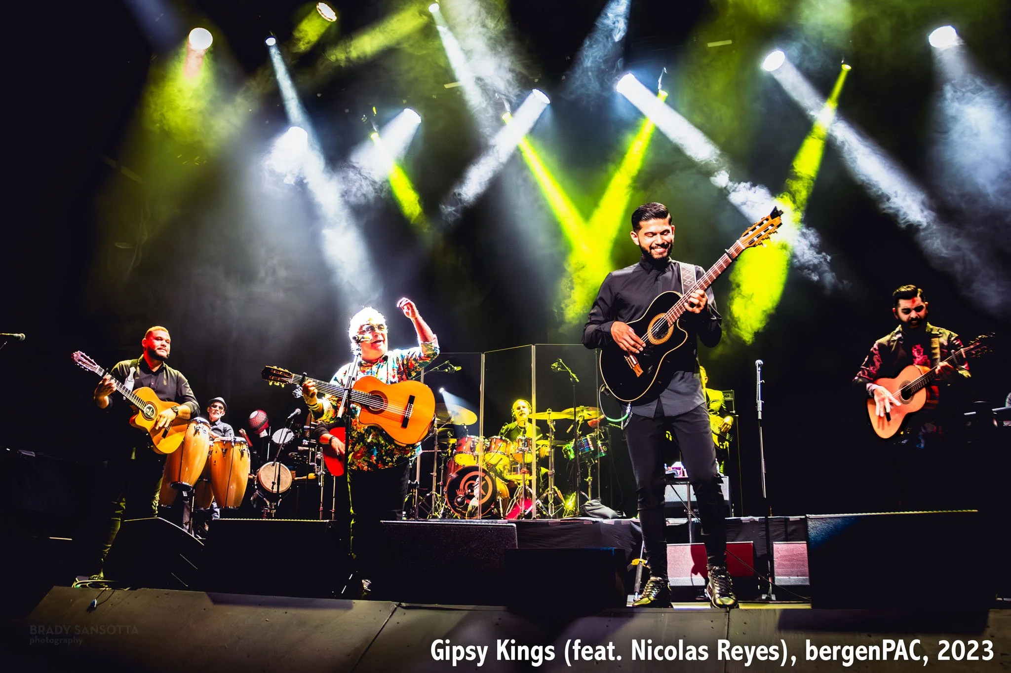 Wide stage shot of the Gipsy Kings featuring Nicolas Reyes under dramatic lighting at BergenPAC in Englewood, NJ.