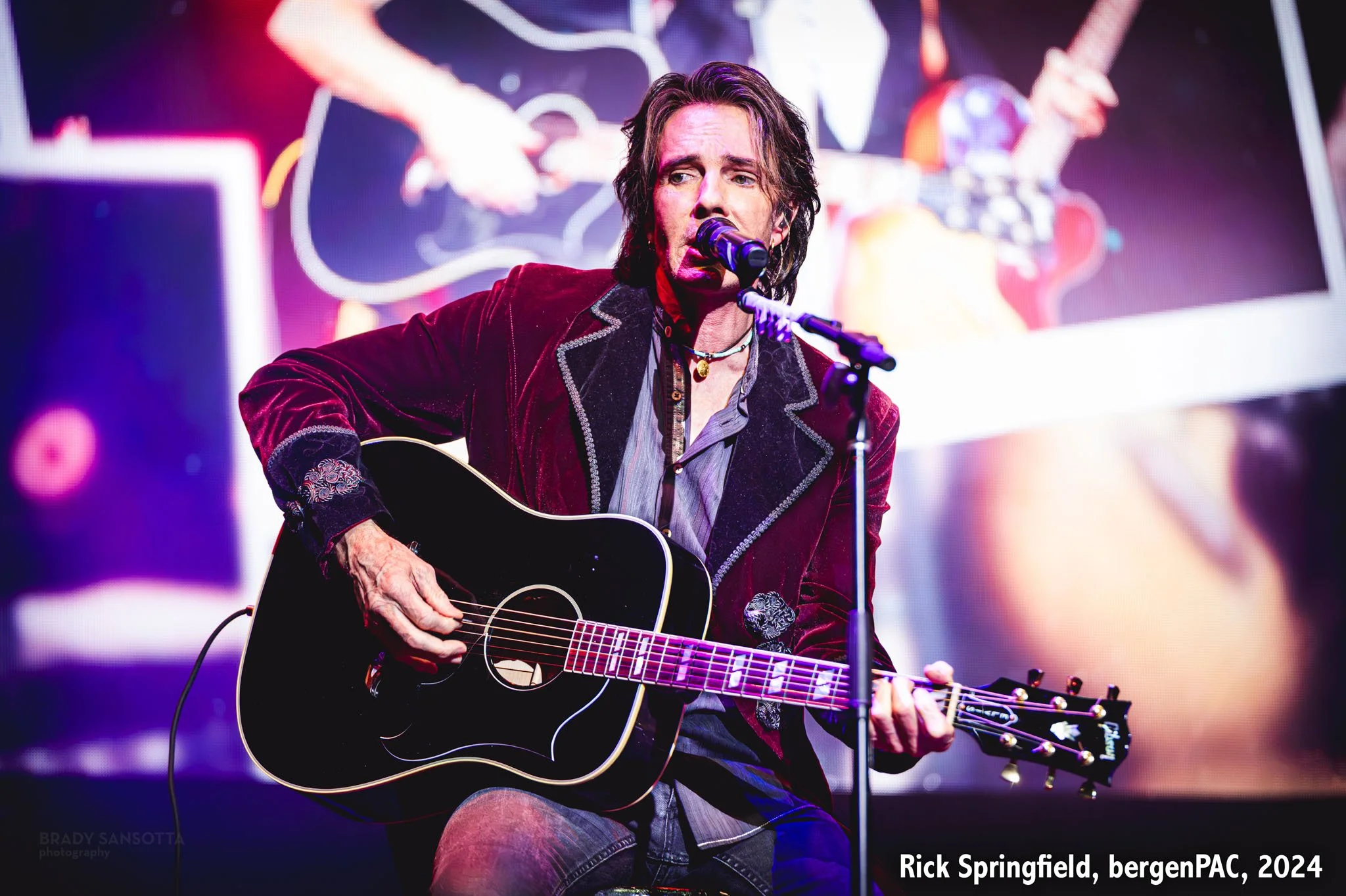 Rick Springfield performing live with guitar during a rock concert at BergenPAC in Englewood, NJ.
