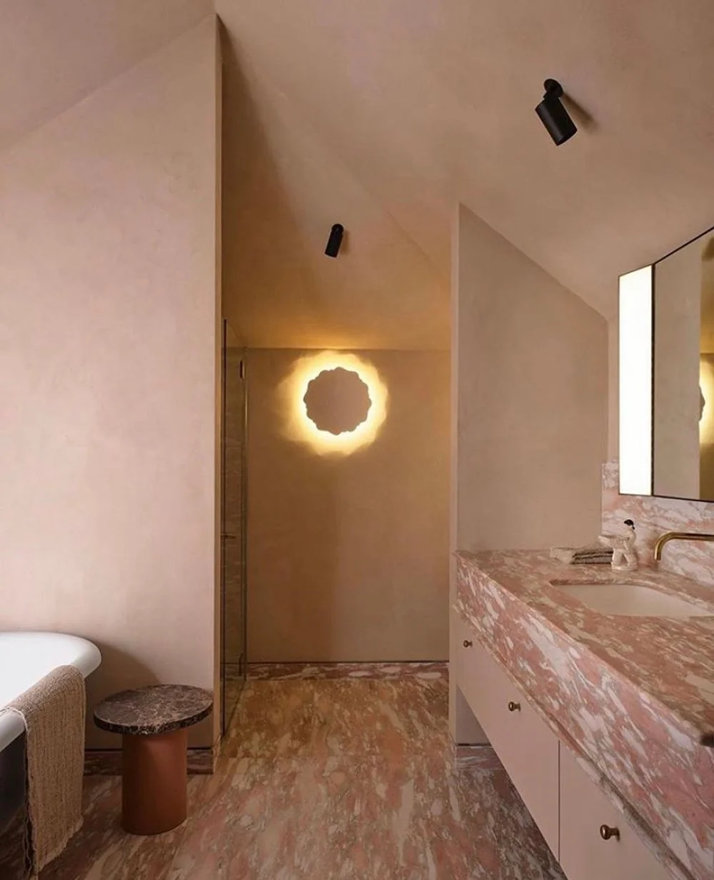 Pink toned Microcement bathroom.