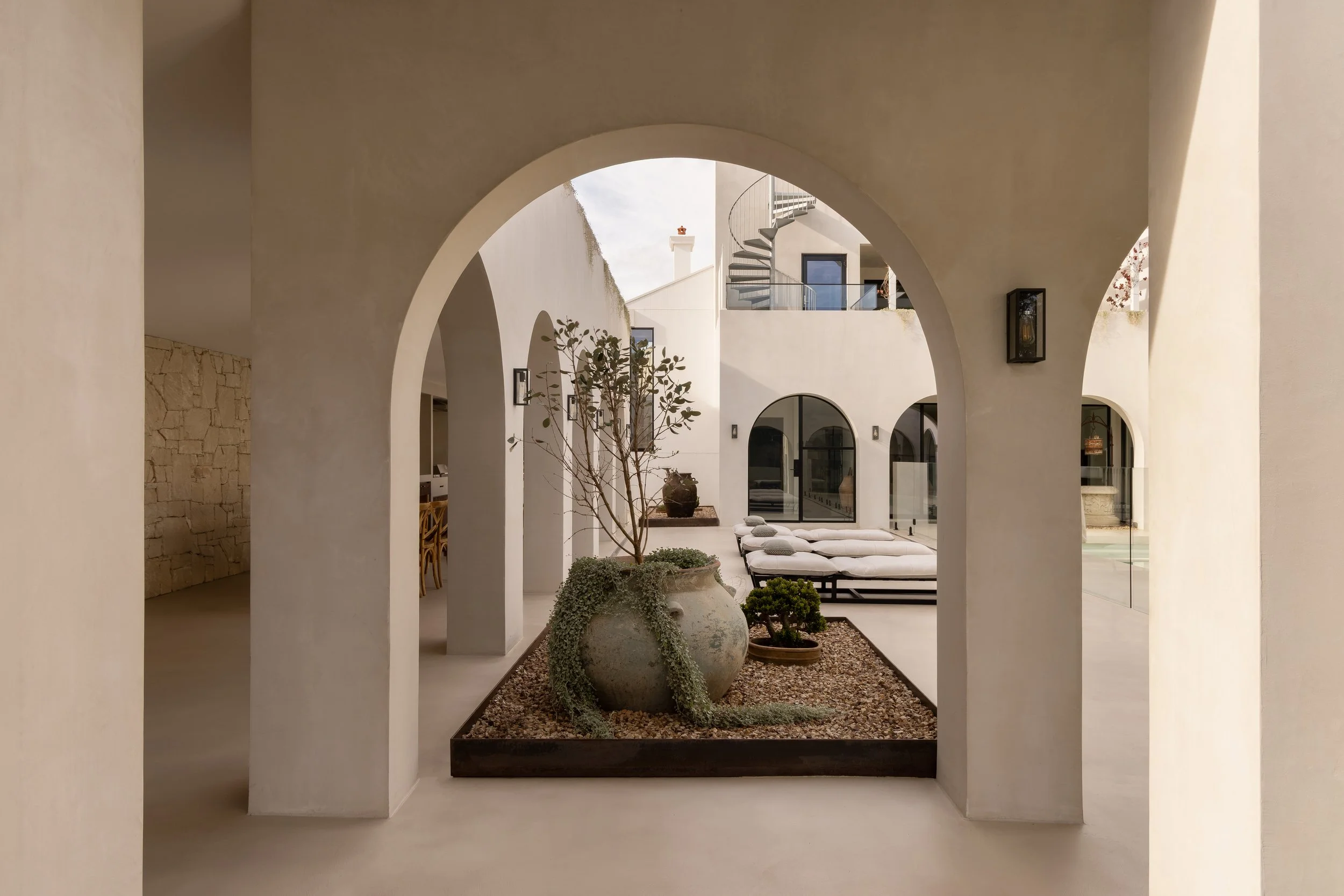 coastal home with microcement walls and pool area
