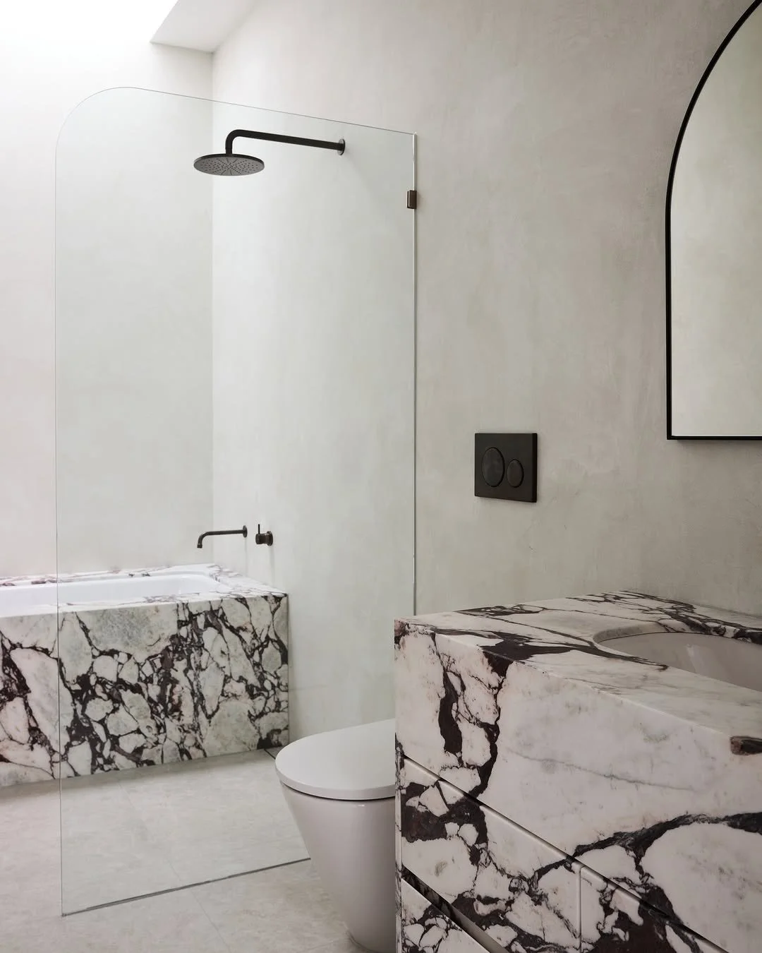 bathroom with x-bond microcement walls in white and viola marble joinery