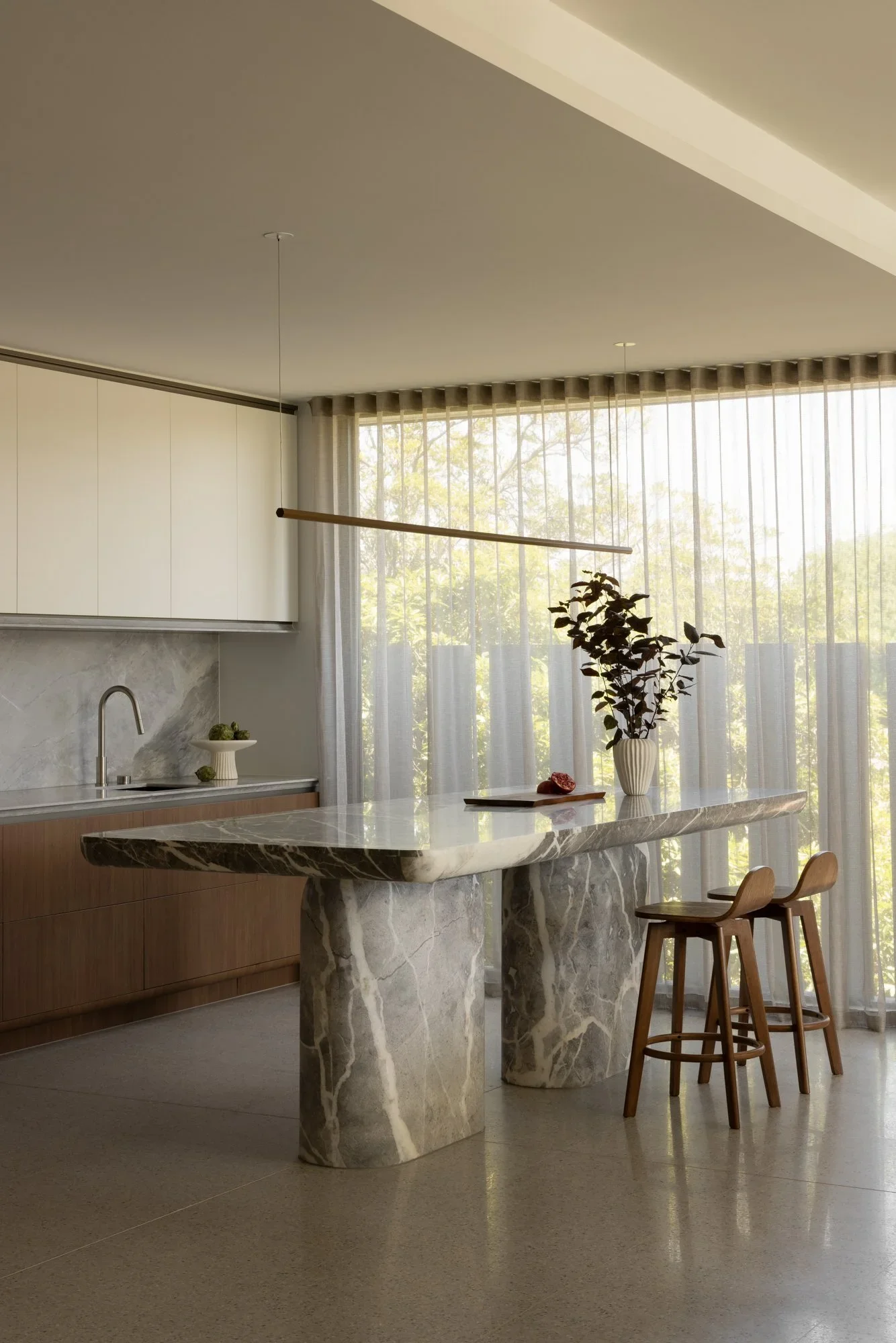 The kitchen featuring a statement island.