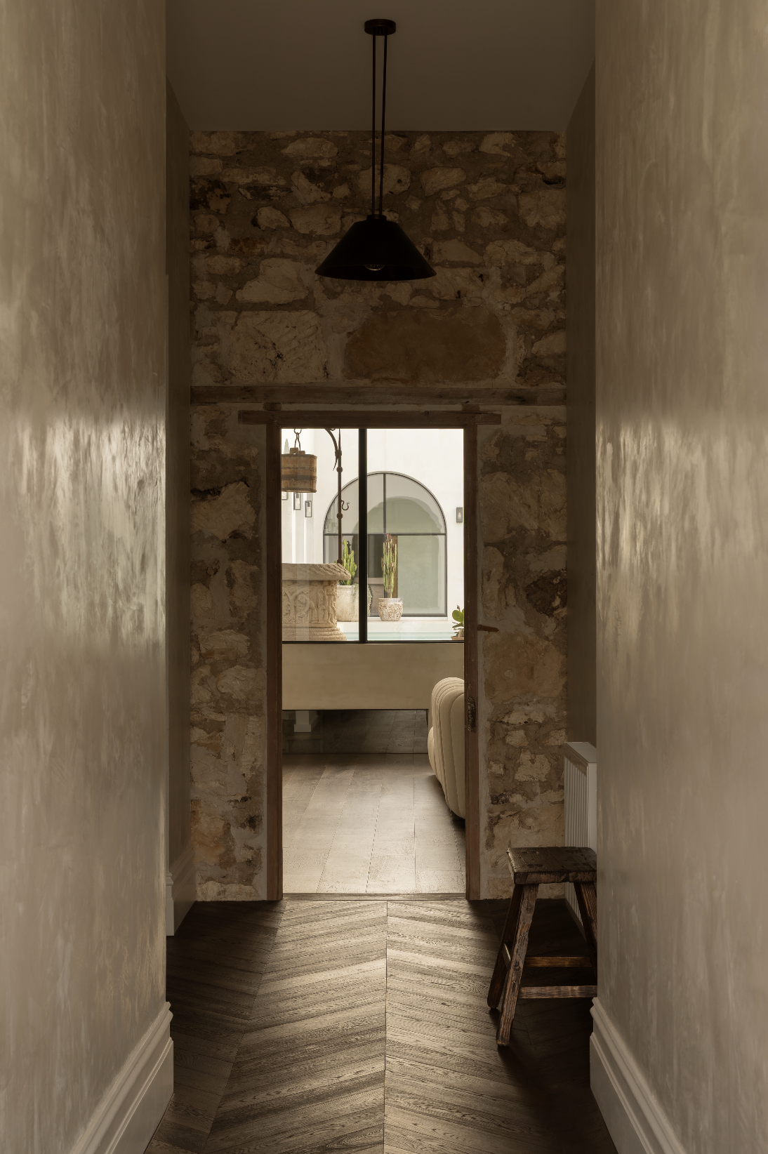 hallway with stone and microcement walls