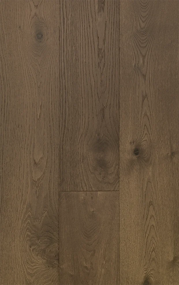 Close-up of a wooden floor with visible wood grain and knots.