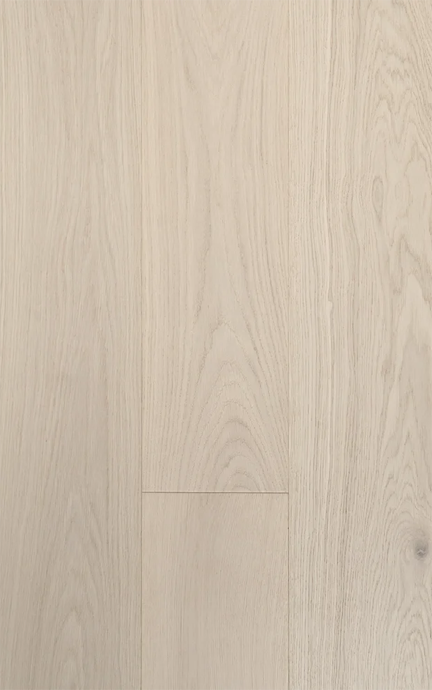 Close-up of light-colored wooden floor tiles showing grain patterns and seams.