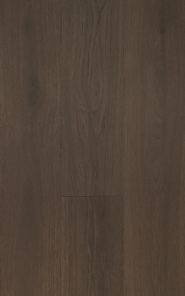 Close-up image of a wooden surface, possibly a hardwood floor or table, showing wood grain and finish.