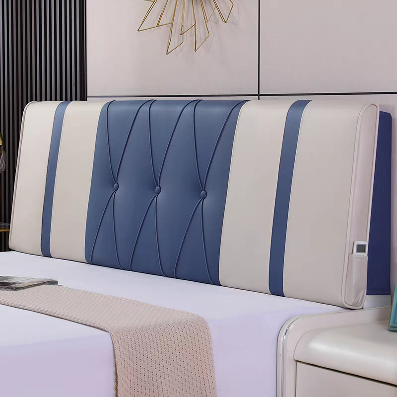 A modern headboard with blue and white padded sections and a built-in control panel on the side, situated in a contemporary bedroom.