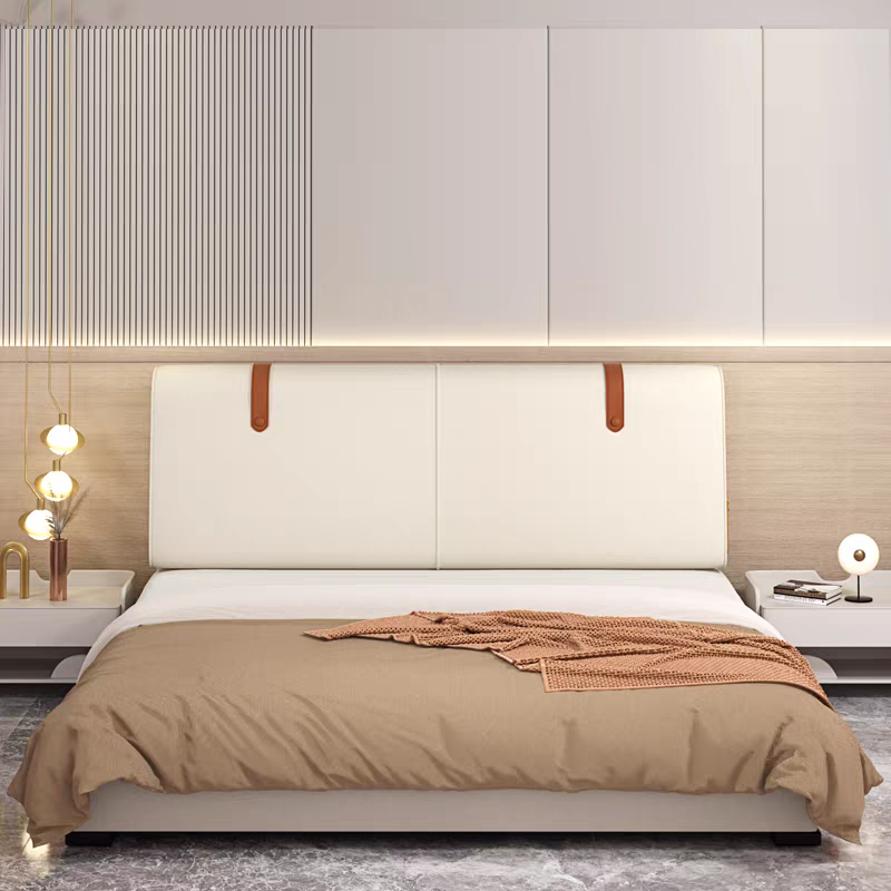 Modern bedroom with a white bed, beige bedding, and a textured blanket. A nightstand with a lamp and decor, a stylish wall with vertical paneling and lighting details.