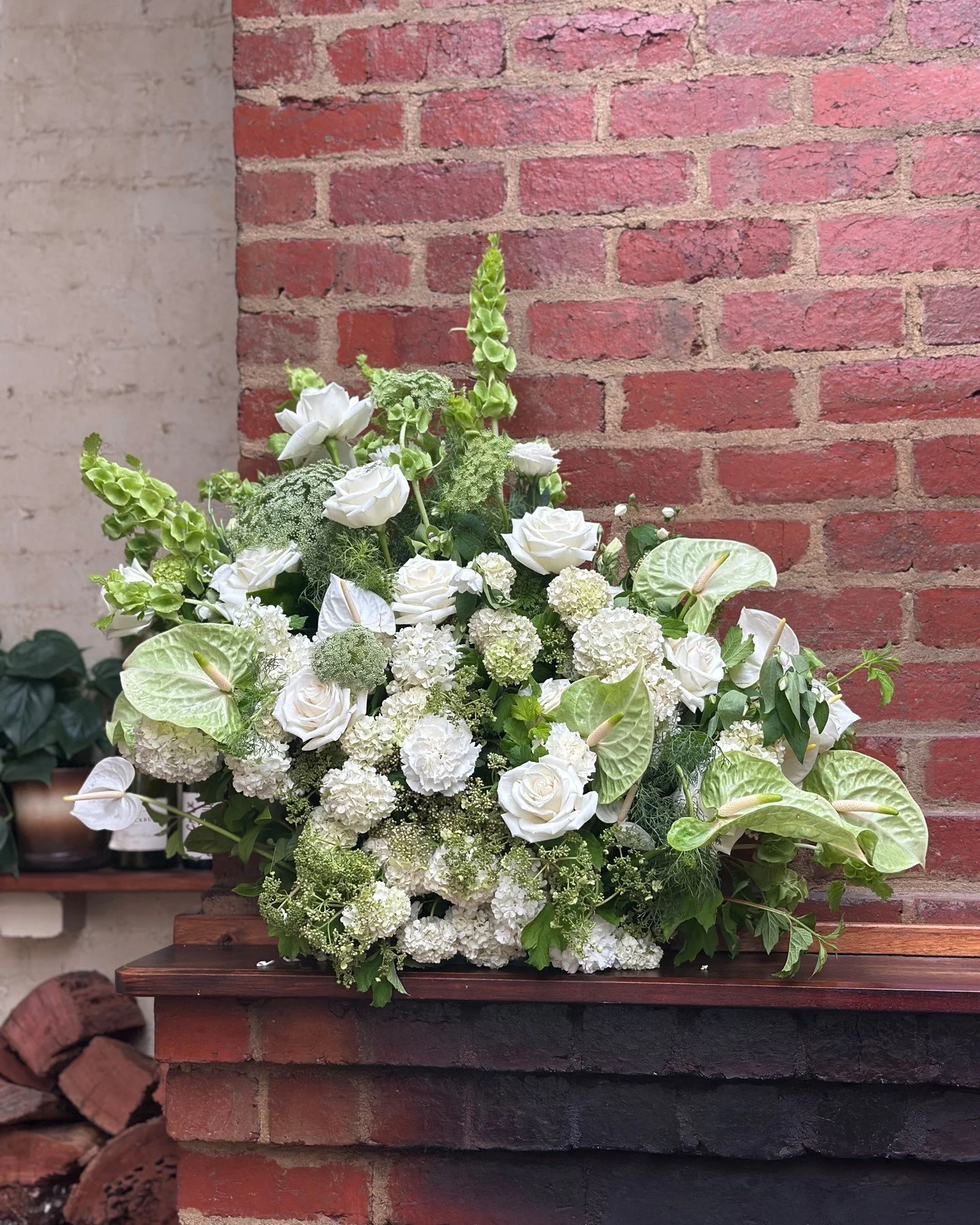 Obsessed with this arrangement we created for Kirstie &amp; Daniel&rsquo;s wedding. 

Perched on the shelf above the fireplace with a mix of soft white snowballs, lime green Anthuriums, relaxed white roses and textured queen Anna lace that created th